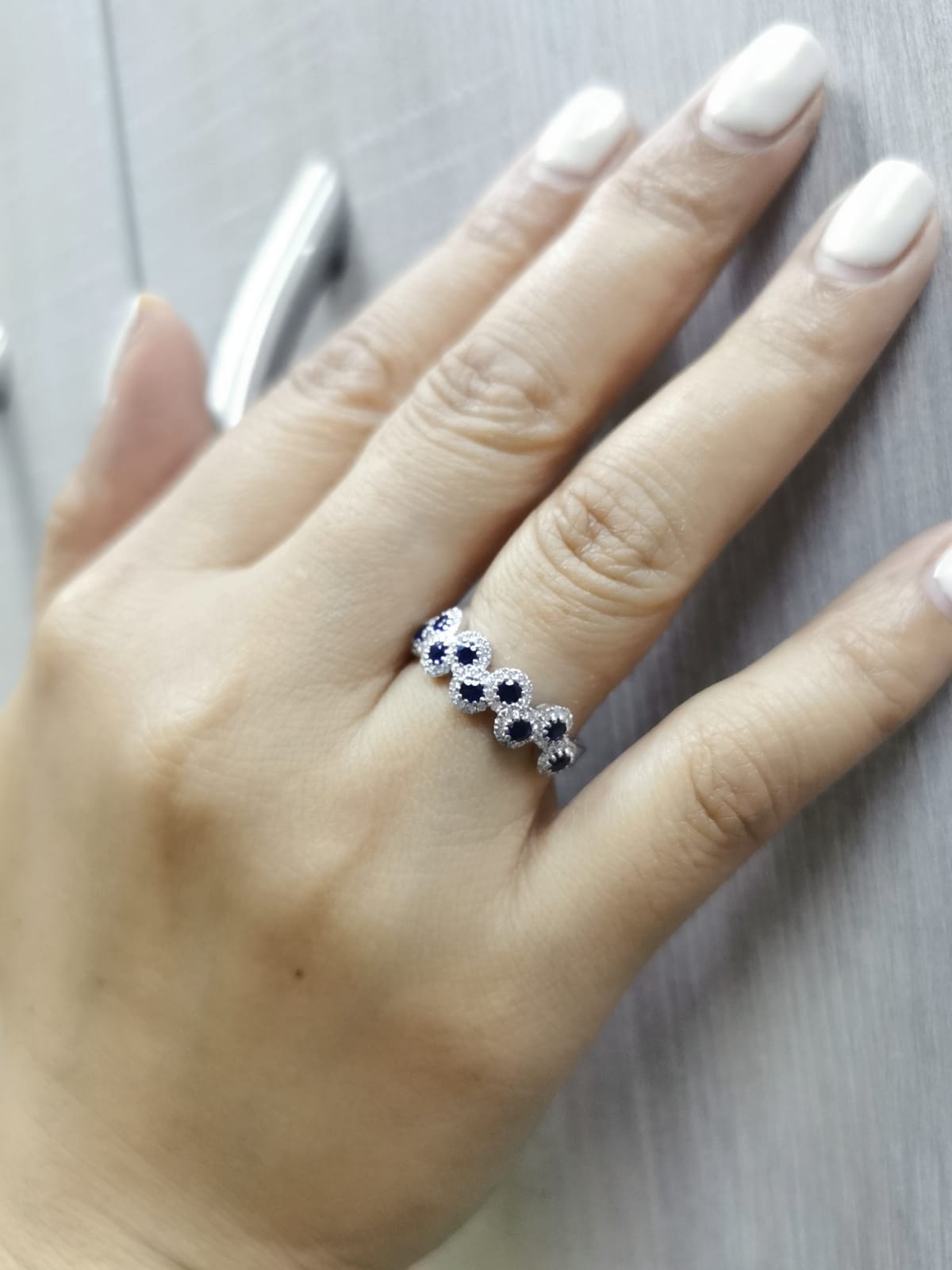 Sapphire and diamond halo ring in 18K gold
