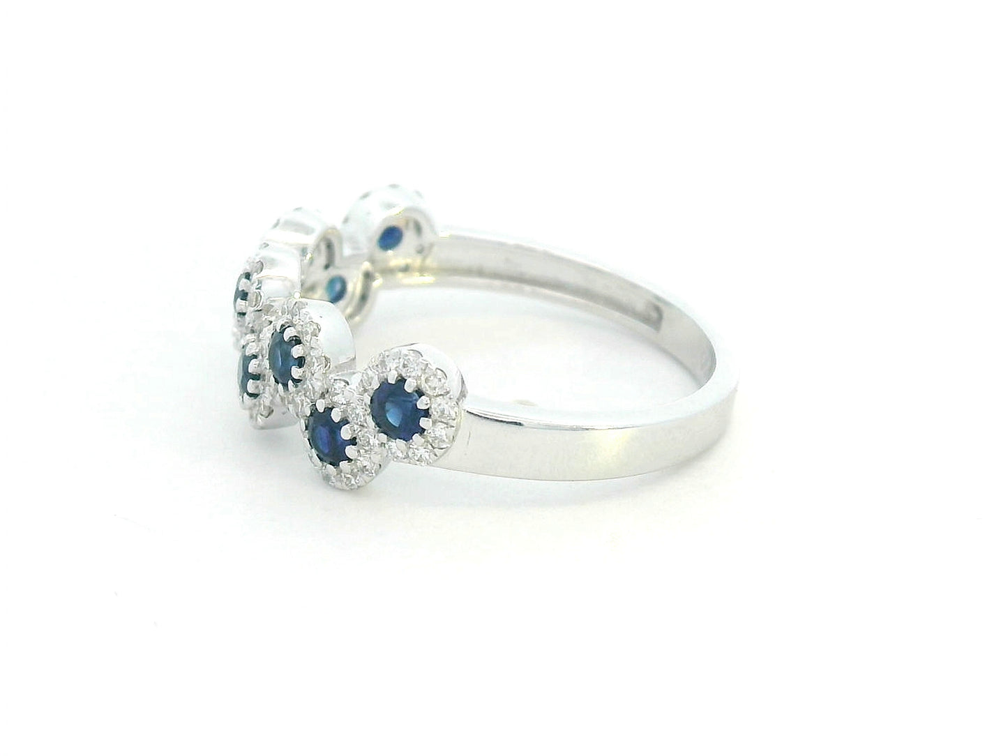 Luxury gemstone ring with alternating sapphire and diamond clusters