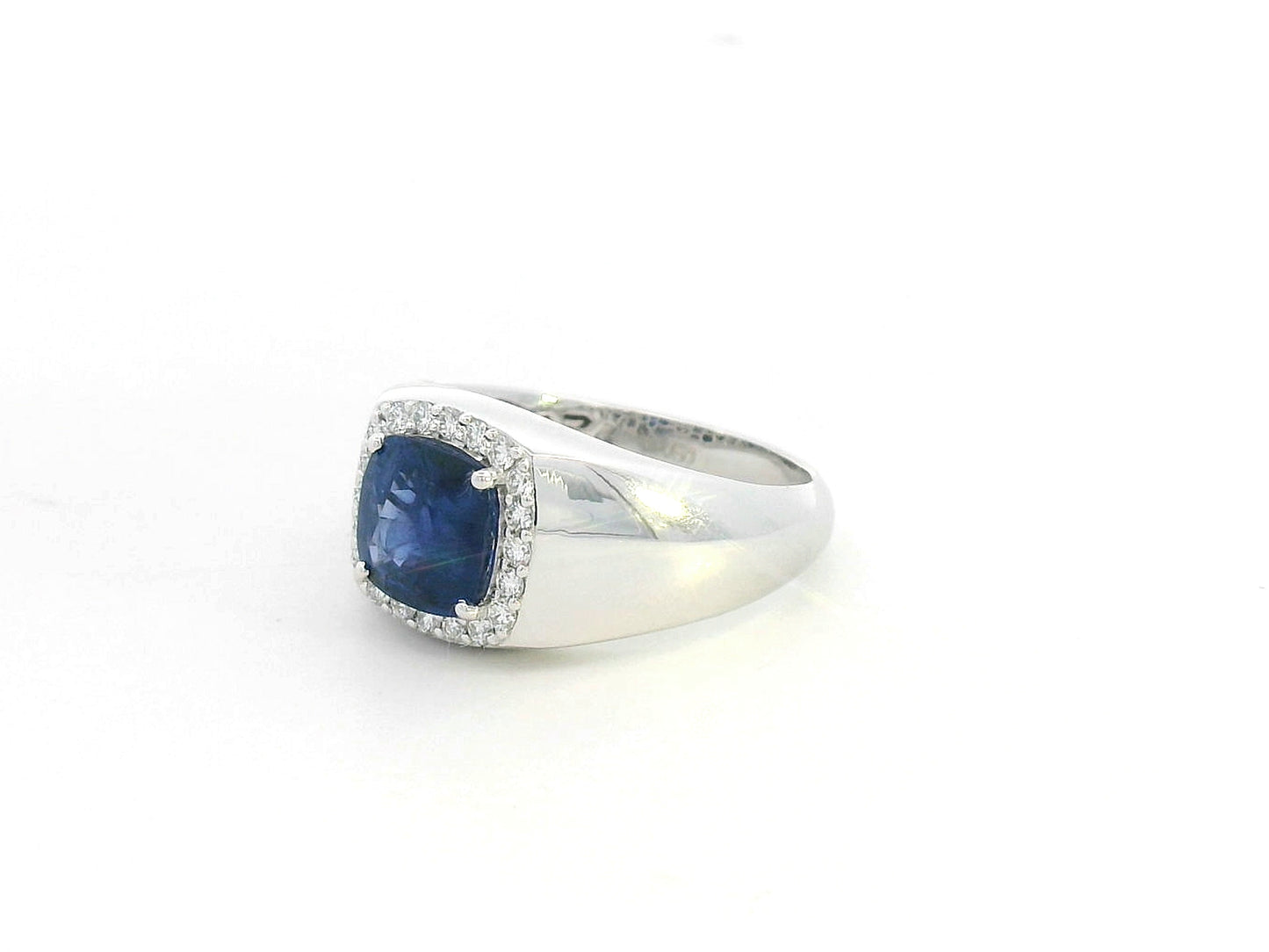 18K white gold men’s ring with 2.67ct cushion-cut blue sapphire and 0.30ct diamond halo.