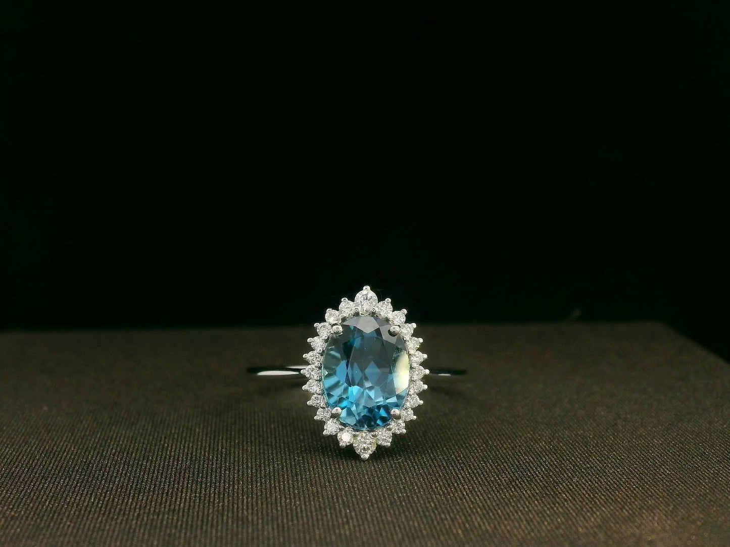 18k white gold London Blue Topaz and diamond halo ring