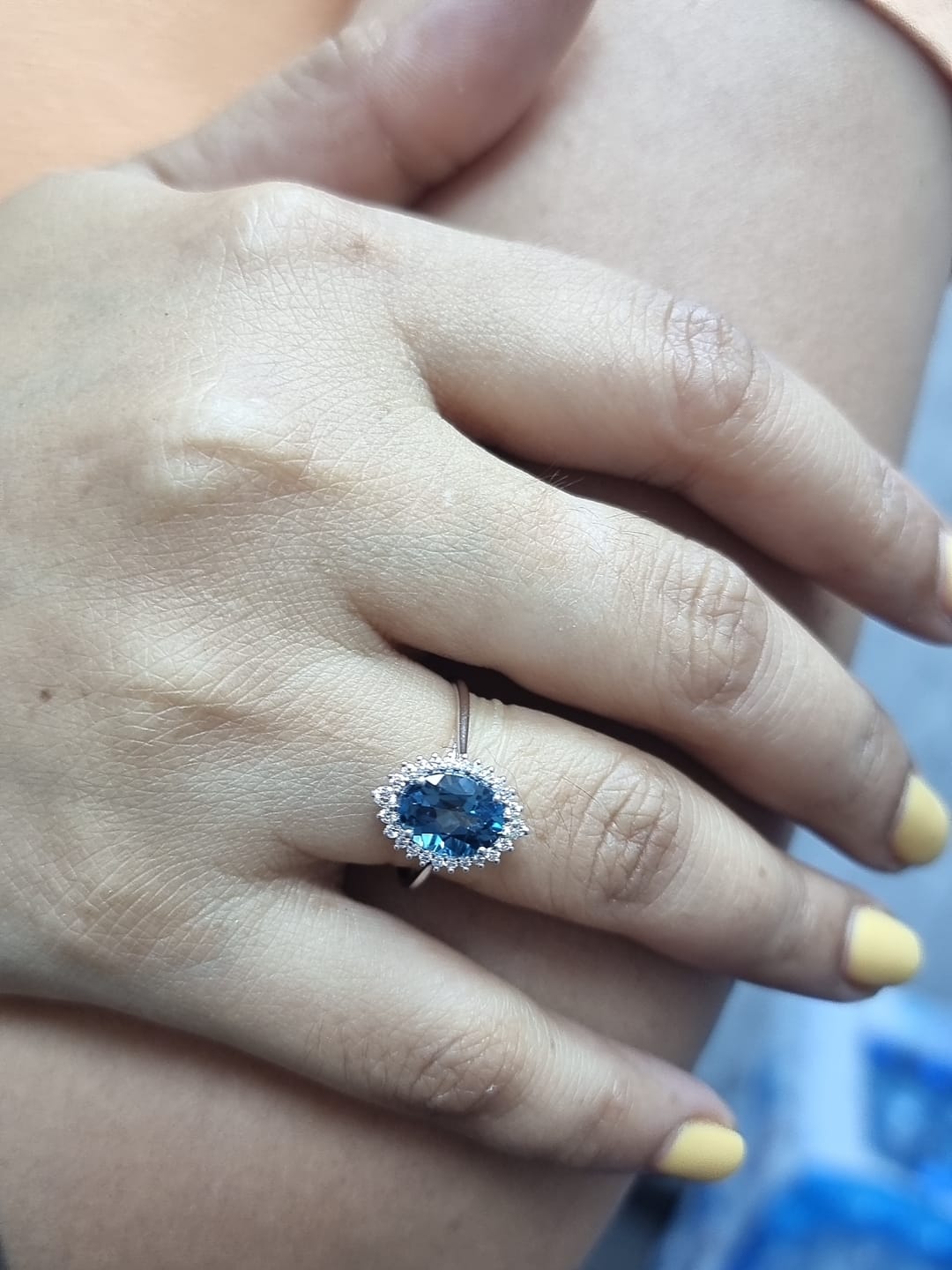 18k white gold London Blue Topaz and diamond halo ring