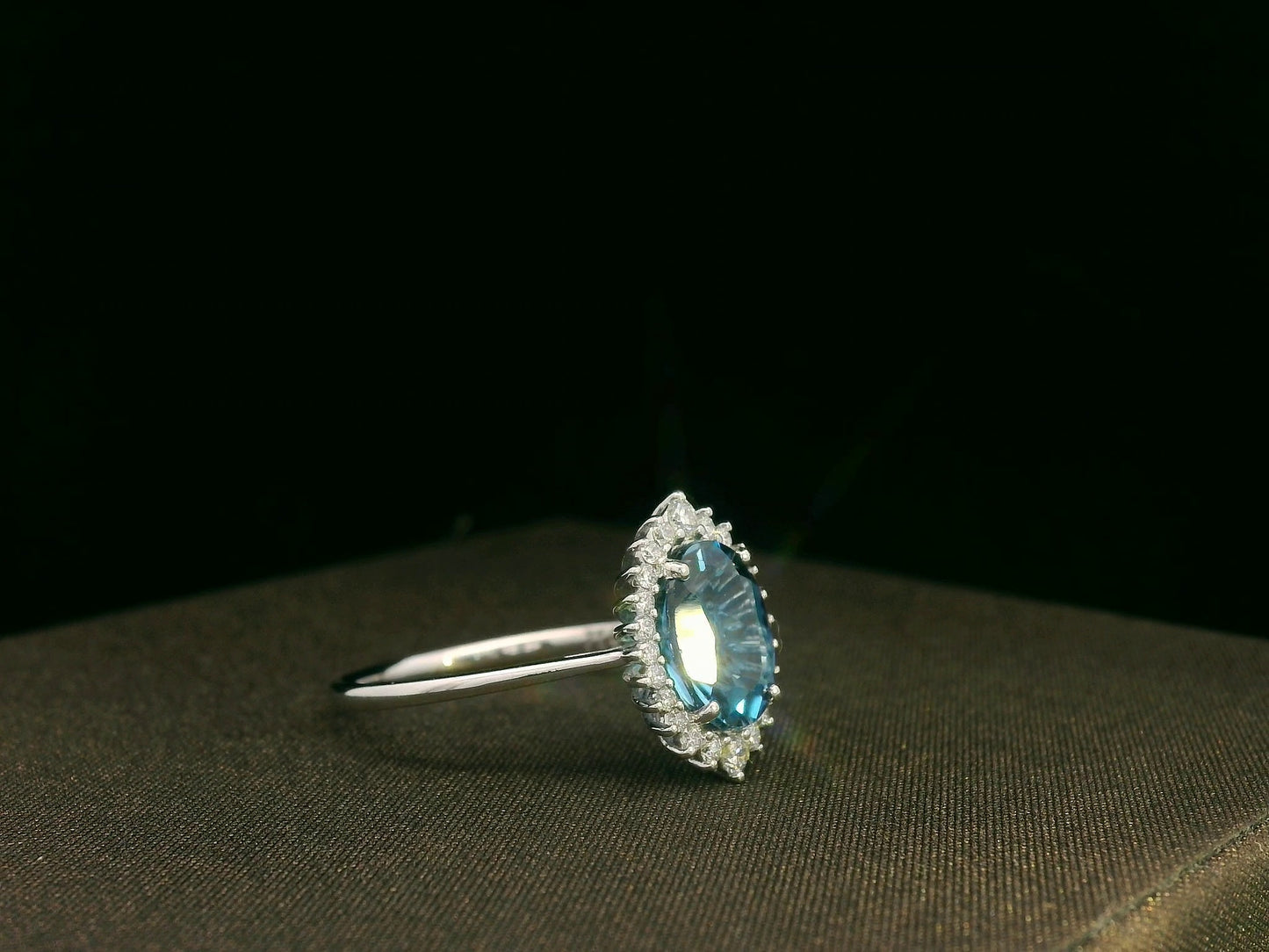 18k white gold London Blue Topaz and diamond halo ring