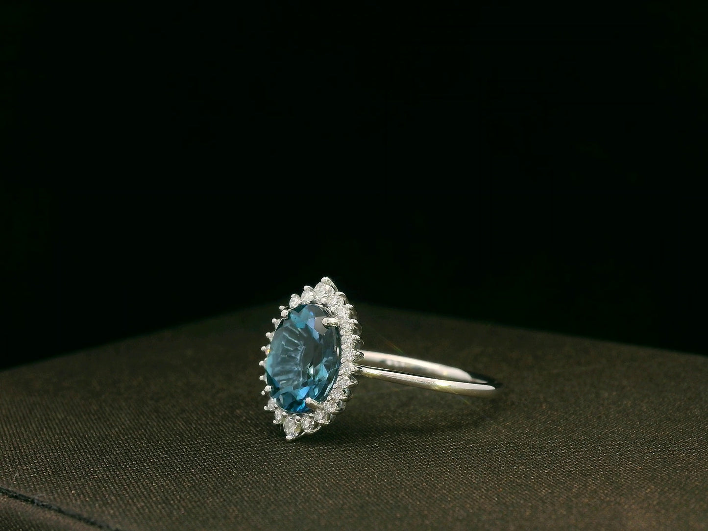 18k white gold London Blue Topaz and diamond halo ring
