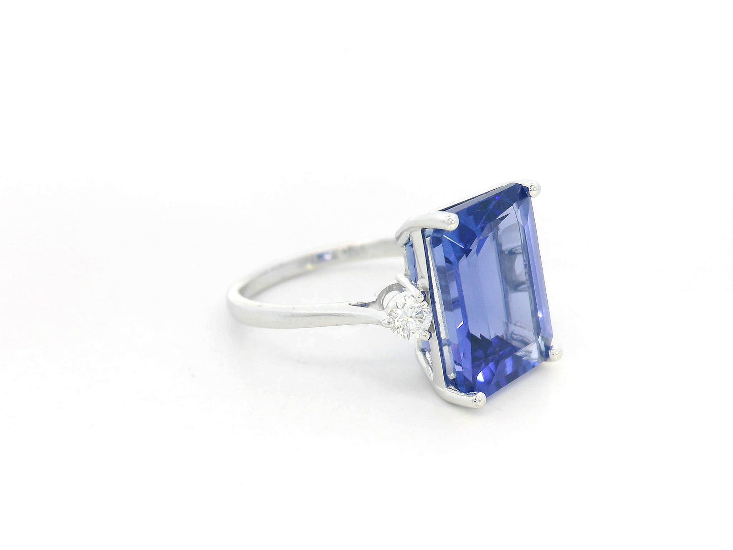 8.04 Carat Emerald-Cut Tanzanite Ring with Diamond Accents in 18K Gold
