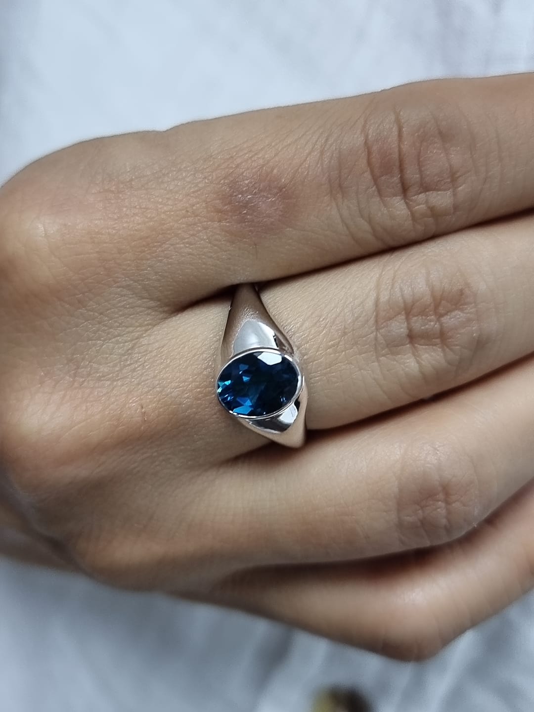 18k white gold ring with 2.13ct oval London Blue Topaz in modern bezel setting – certificate included