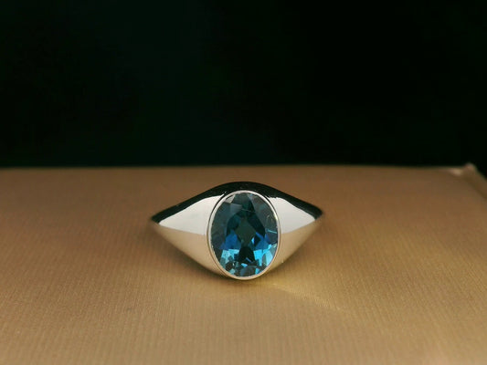 18k white gold ring with 2.13ct oval London Blue Topaz in modern bezel setting – certificate included