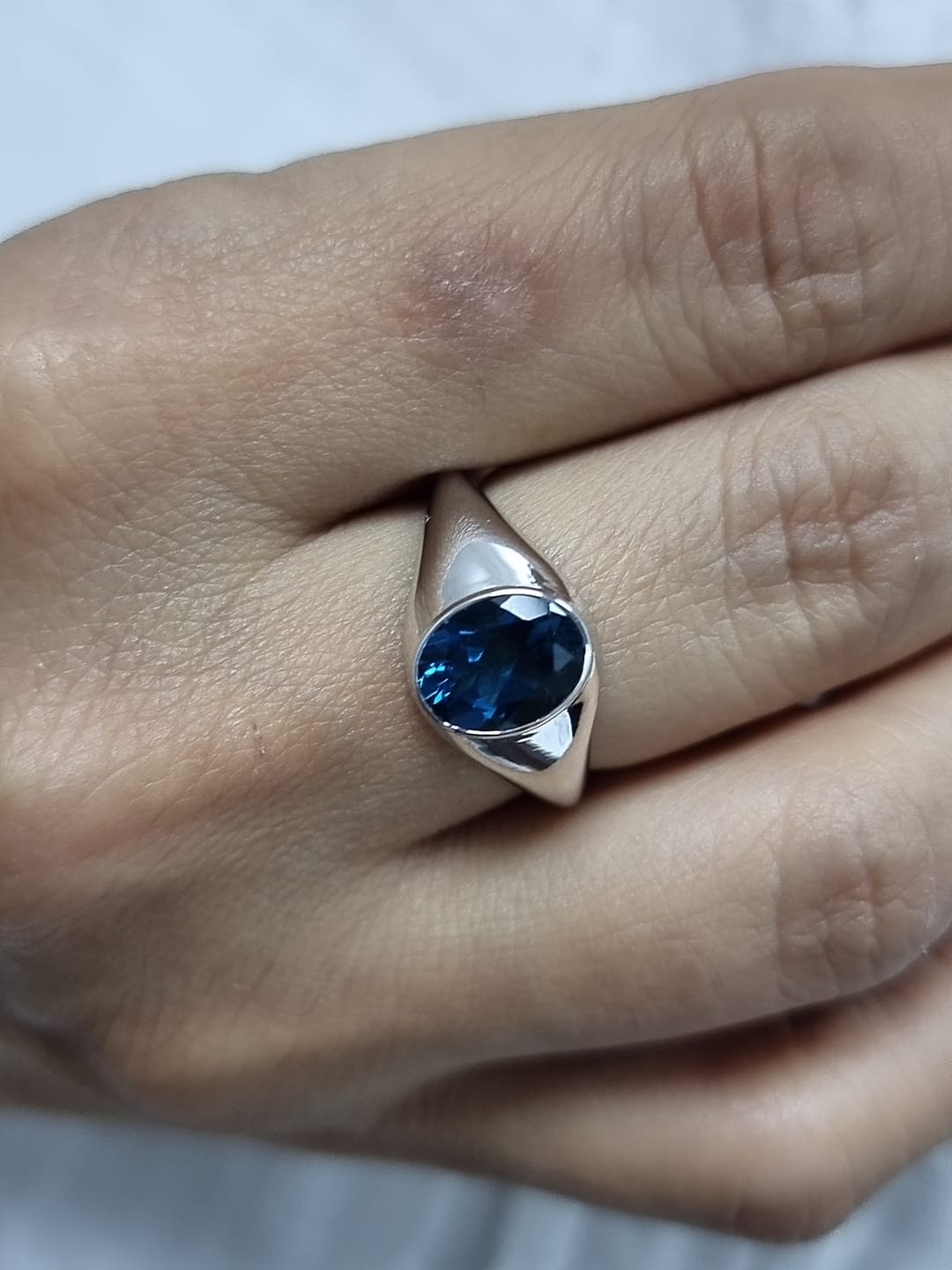18k white gold ring with 2.13ct oval London Blue Topaz in modern bezel setting – certificate included