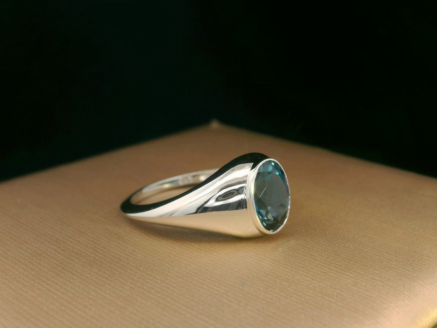18k white gold ring with 2.13ct oval London Blue Topaz in modern bezel setting – certificate included