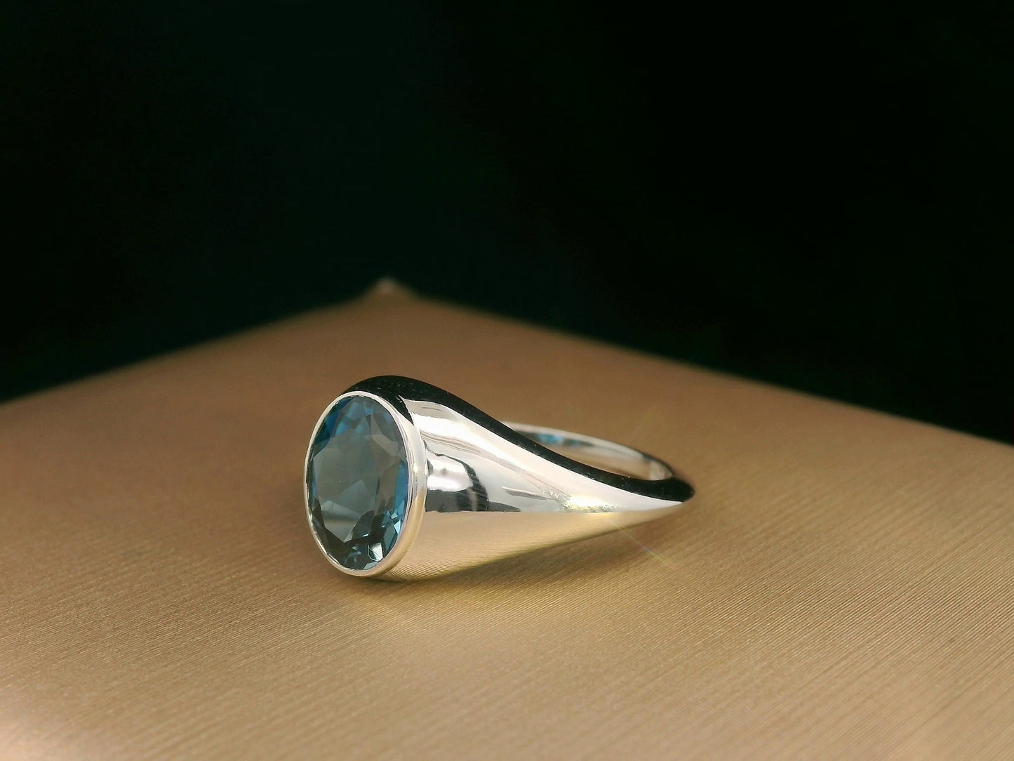 18k white gold ring with 2.13ct oval London Blue Topaz in modern bezel setting – certificate included