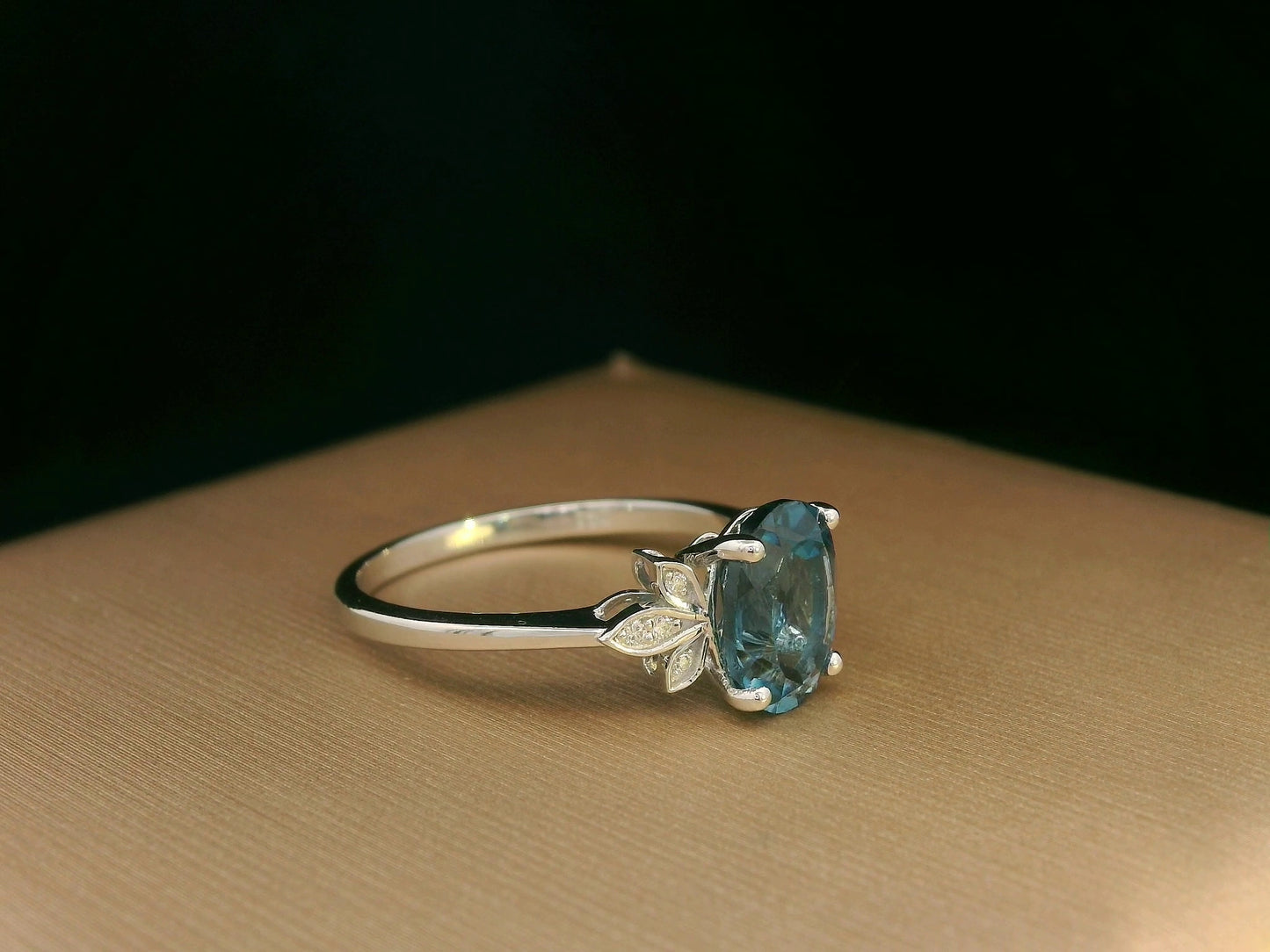 18k white gold ring with 2.35ct oval London Blue Topaz and 0.04ct diamond floral accents – certificate included