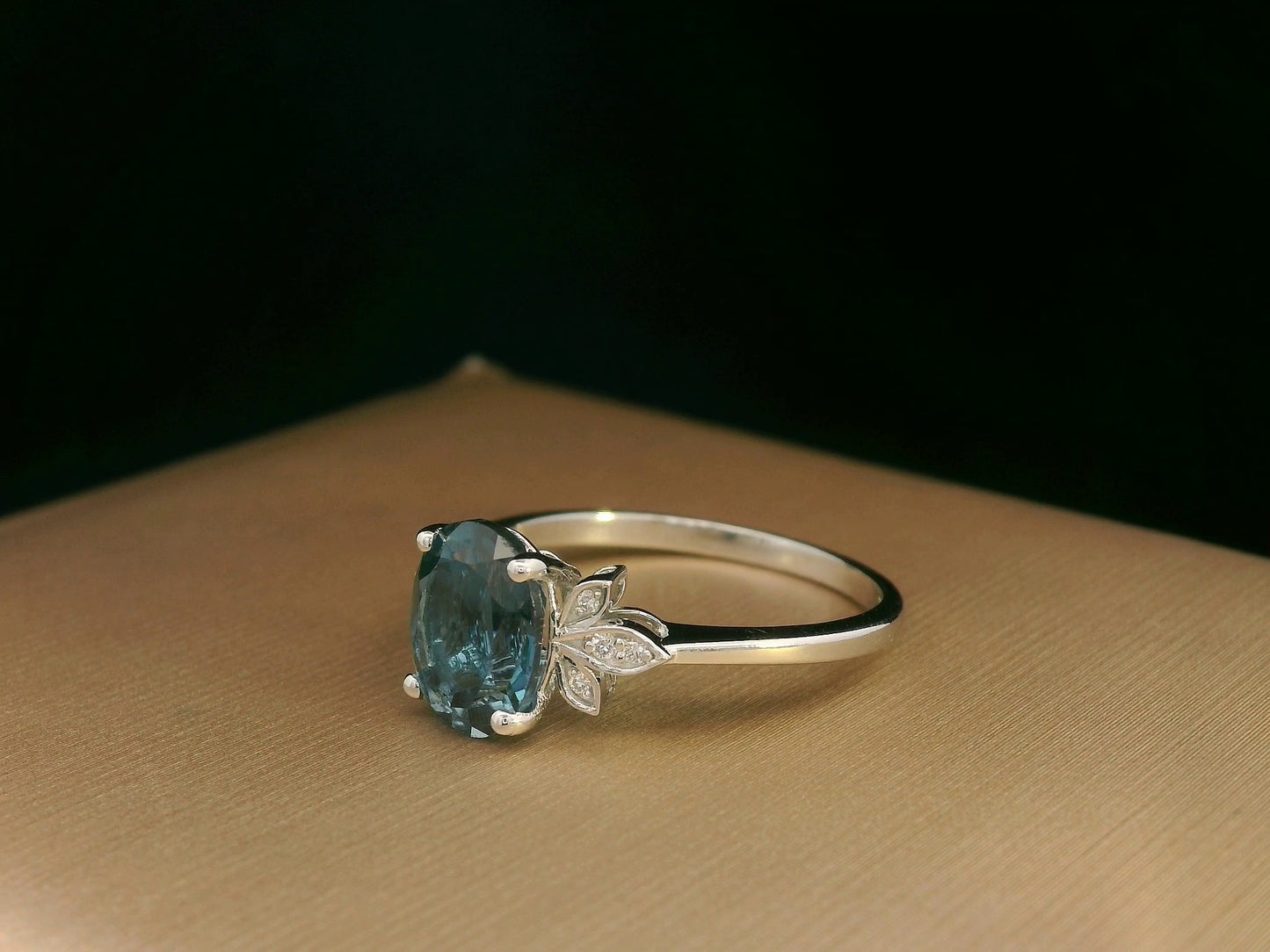 18k white gold ring with 2.35ct oval London Blue Topaz and 0.04ct diamond floral accents – certificate included