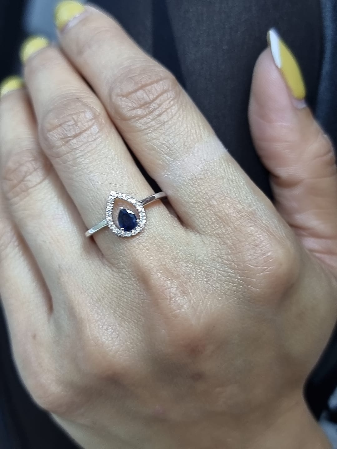 18k white gold ring with 0.41ct pear-cut blue sapphire and 0.11ct open diamond halo – certificate included