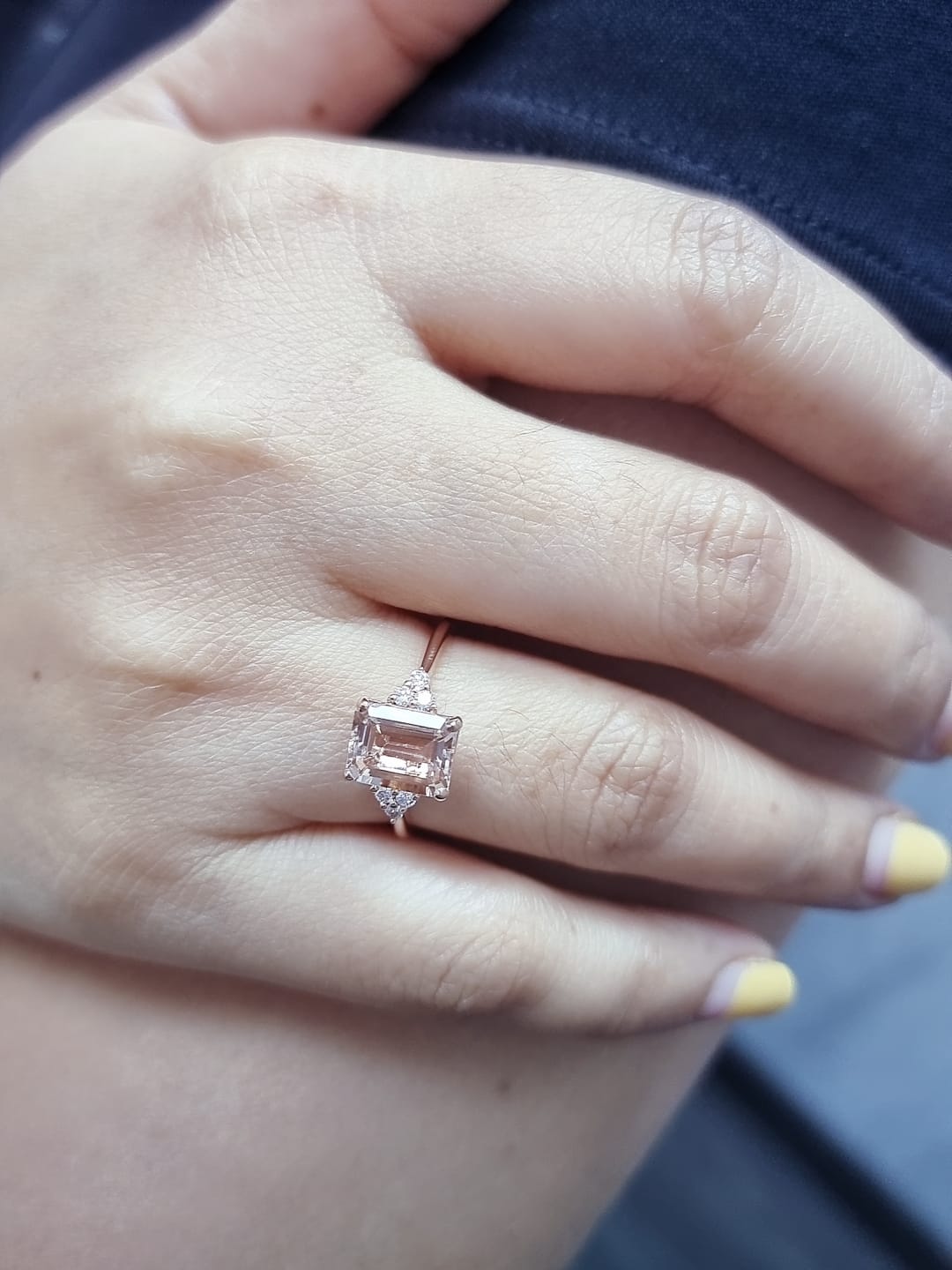 18K rose gold ring featuring a 1.80ct emerald-cut Morganite with diamond clusters on each side.