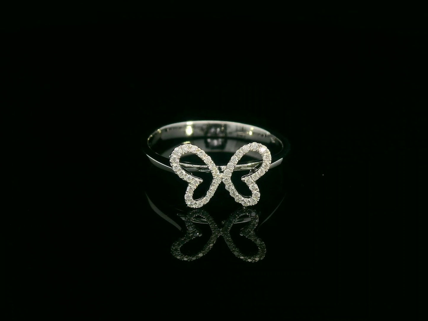 Diamond butterfly ring in 18K white gold with pavé-set wings