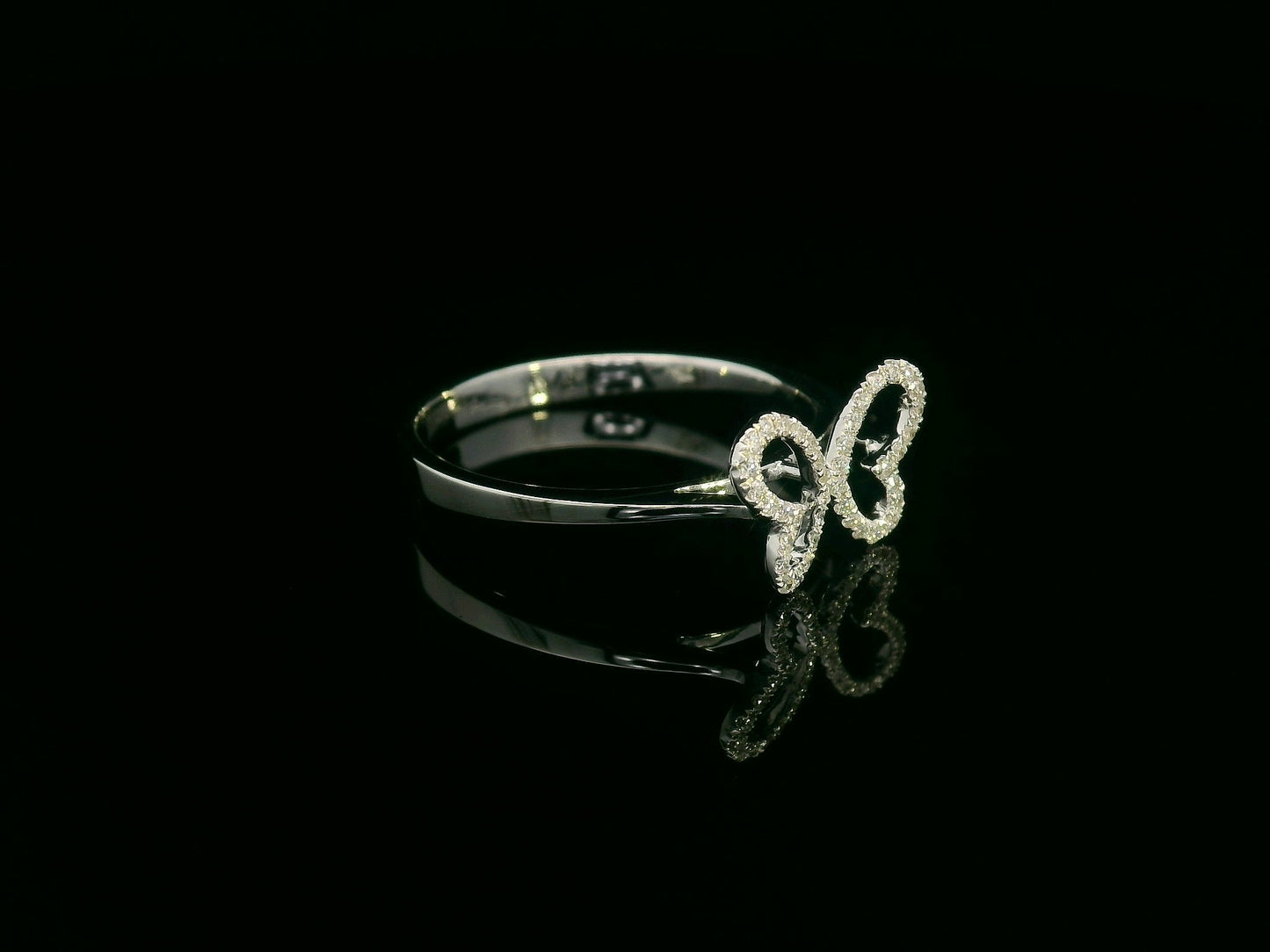 Diamond butterfly ring in 18K white gold with pavé-set wings