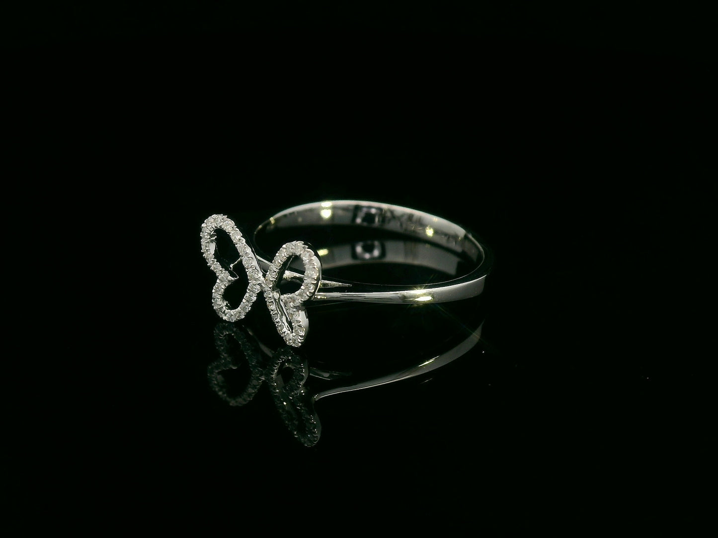 Diamond butterfly ring in 18K white gold with pavé-set wings