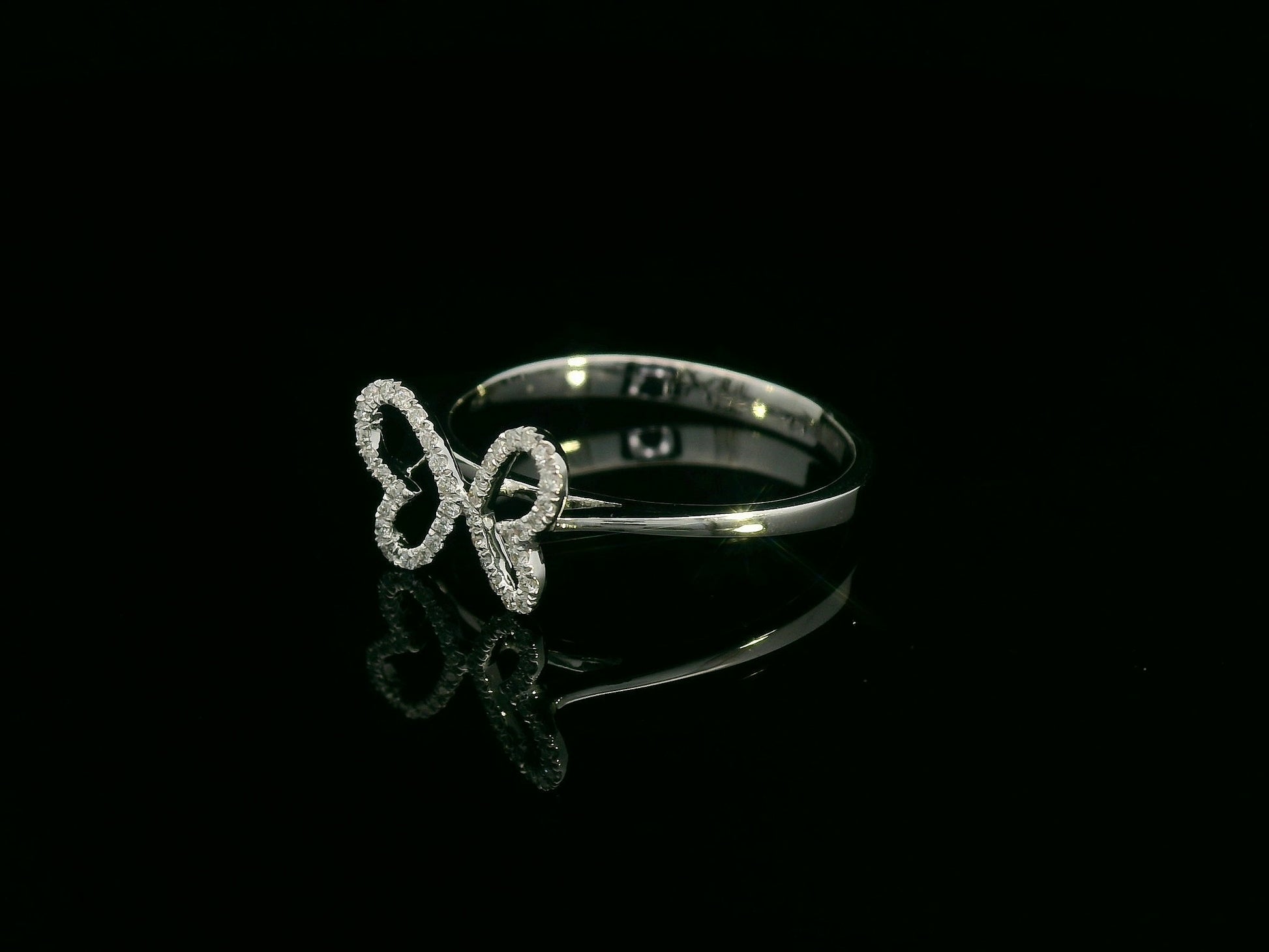 Diamond butterfly ring in 18K white gold with pavé-set wings