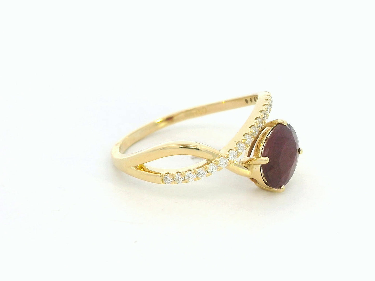 18K yellow gold oval ruby bypass ring with round diamond accents, modern luxury design