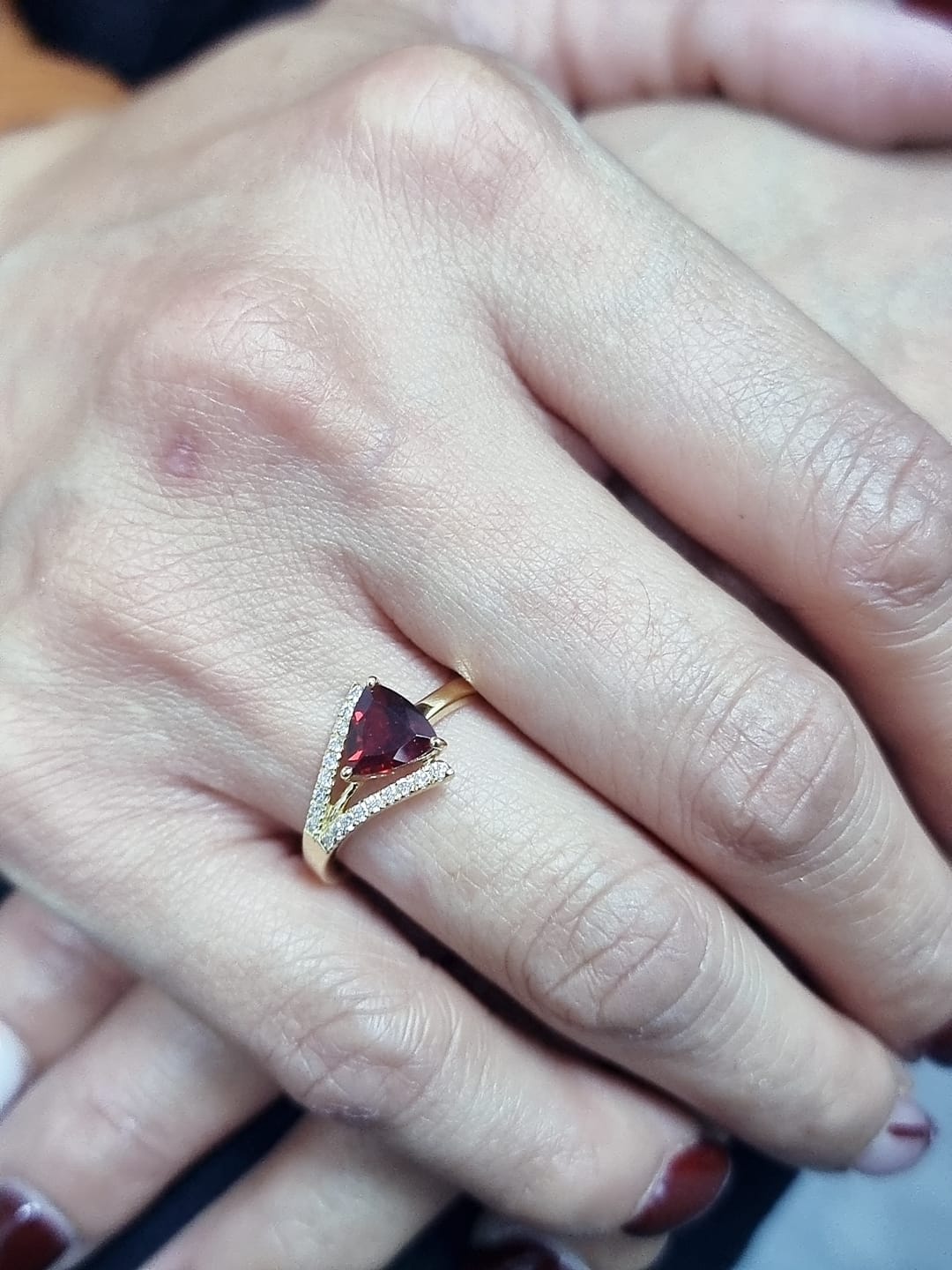 18K yellow gold triangular garnet ring with split-shank pavé diamonds, modern luxury design
