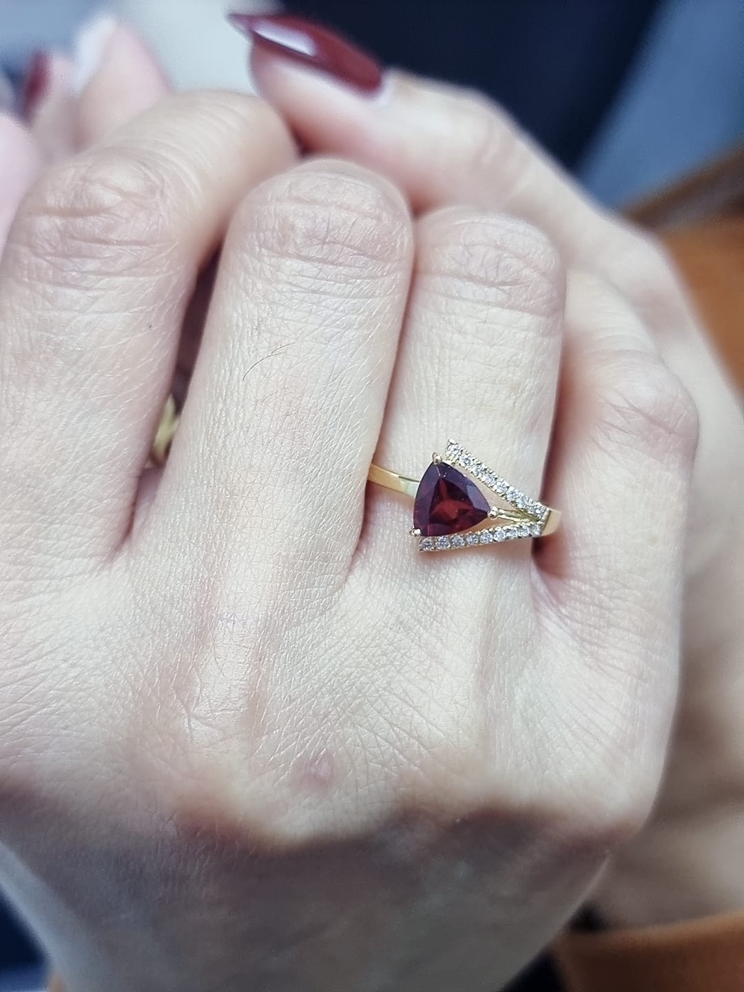 18K yellow gold triangular garnet ring with split-shank pavé diamonds, modern luxury design