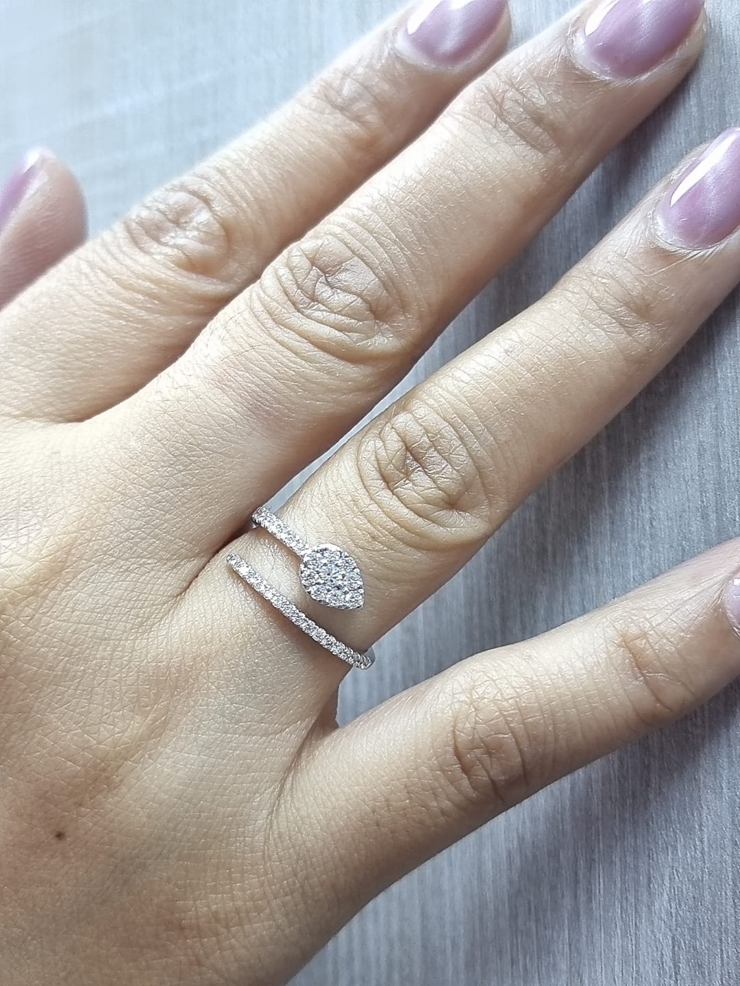 18K gold diamond wrap ring featuring a pavé double-band design with a pear-shaped motif.