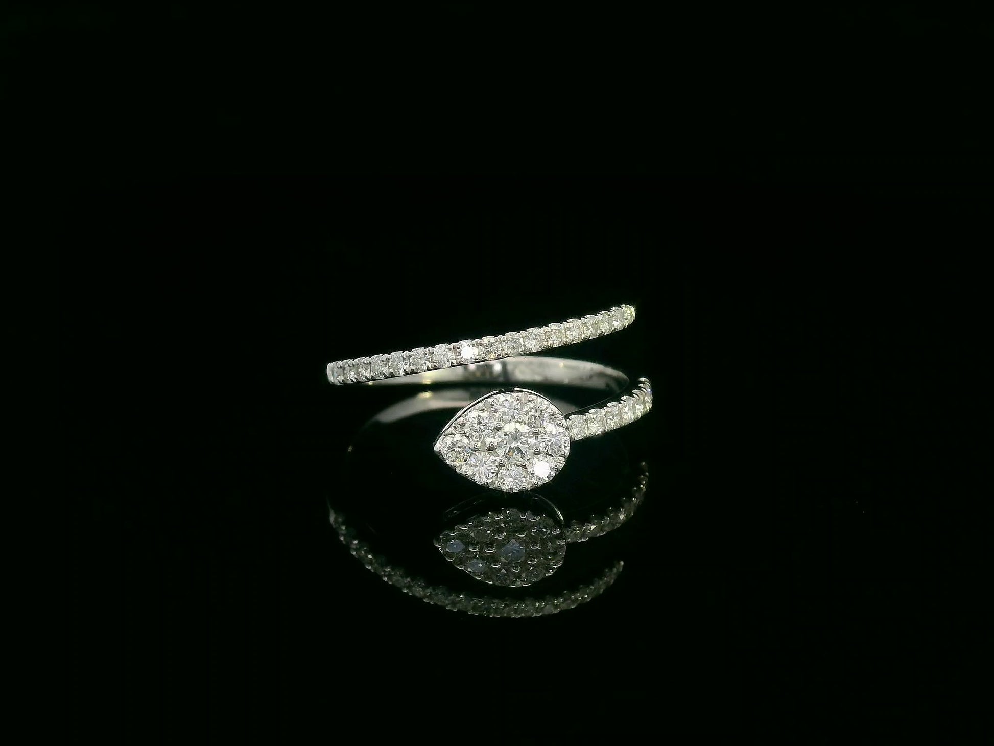 18K gold diamond wrap ring featuring a pavé double-band design with a pear-shaped motif.
