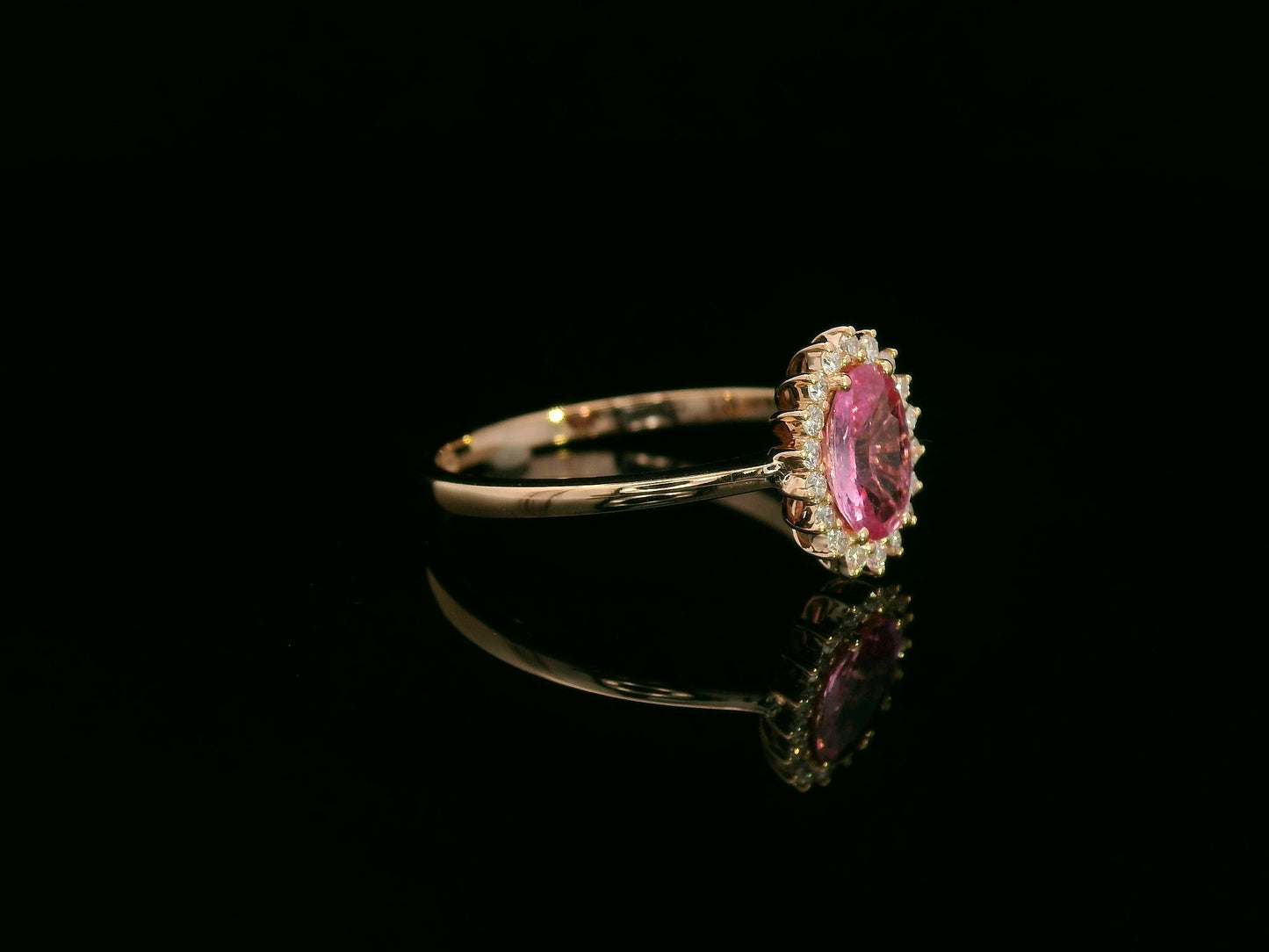18K rose gold oval pink sapphire and diamond halo ring – fine jewelry by Emirates Diamonds.