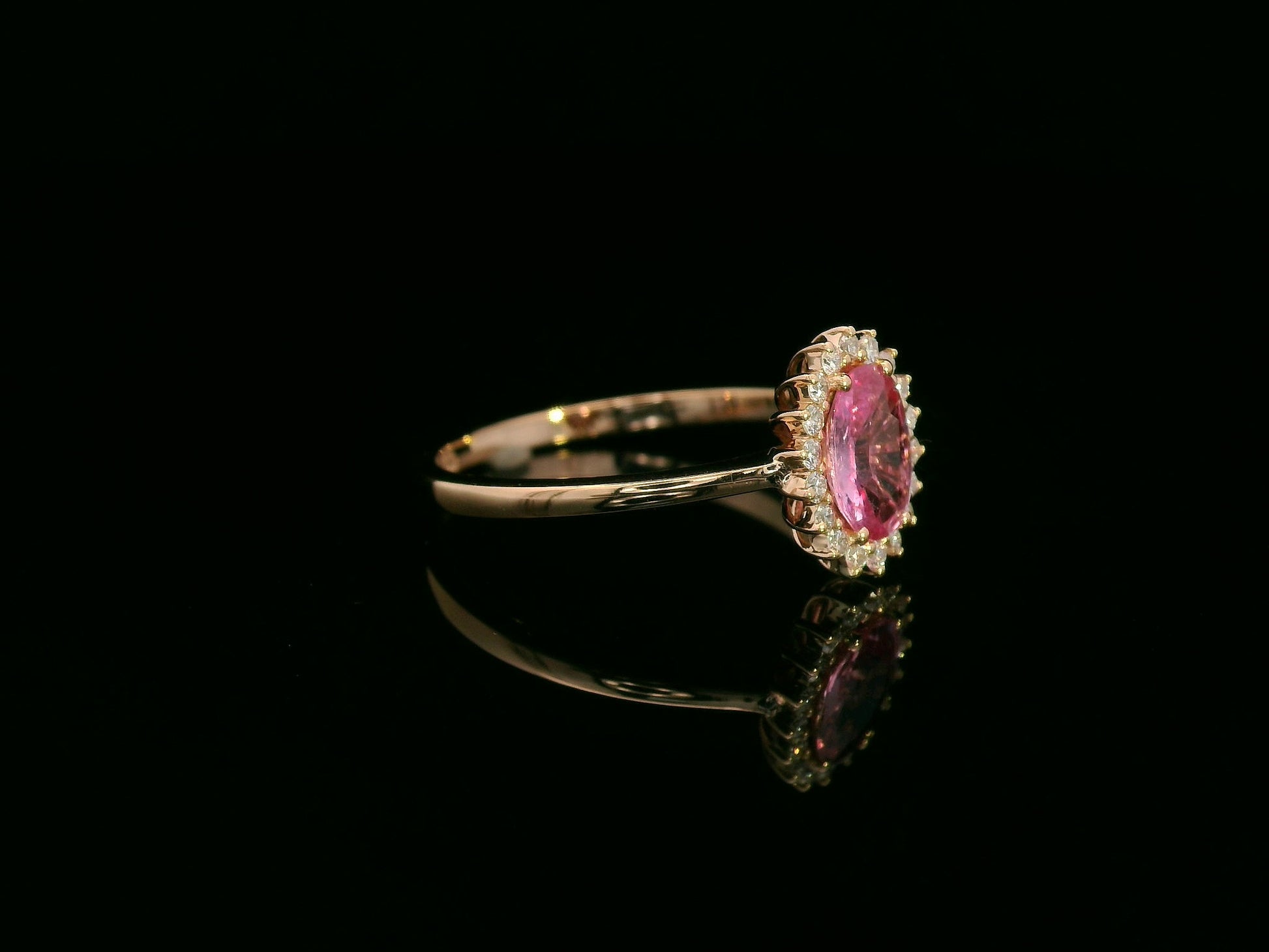18K rose gold oval pink sapphire and diamond halo ring – fine jewelry by Emirates Diamonds.