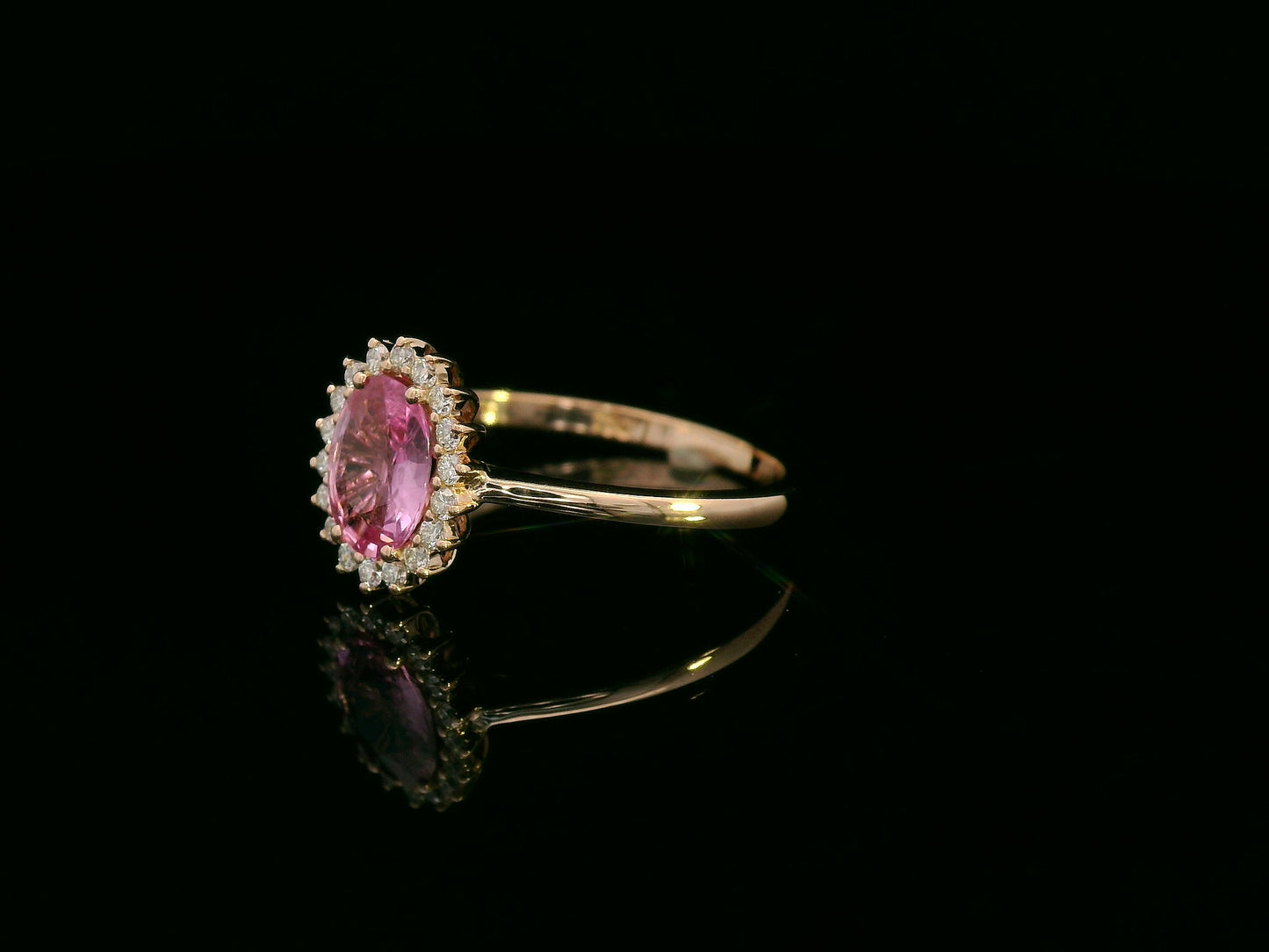 18K rose gold oval pink sapphire and diamond halo ring – fine jewelry by Emirates Diamonds.