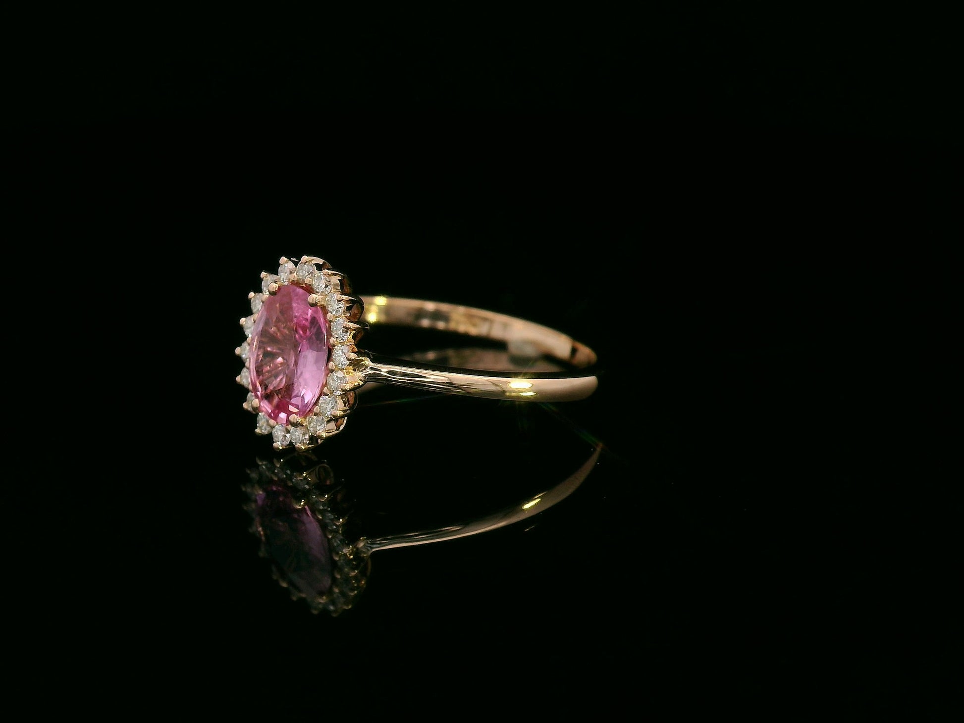 18K rose gold oval pink sapphire and diamond halo ring – fine jewelry by Emirates Diamonds.
