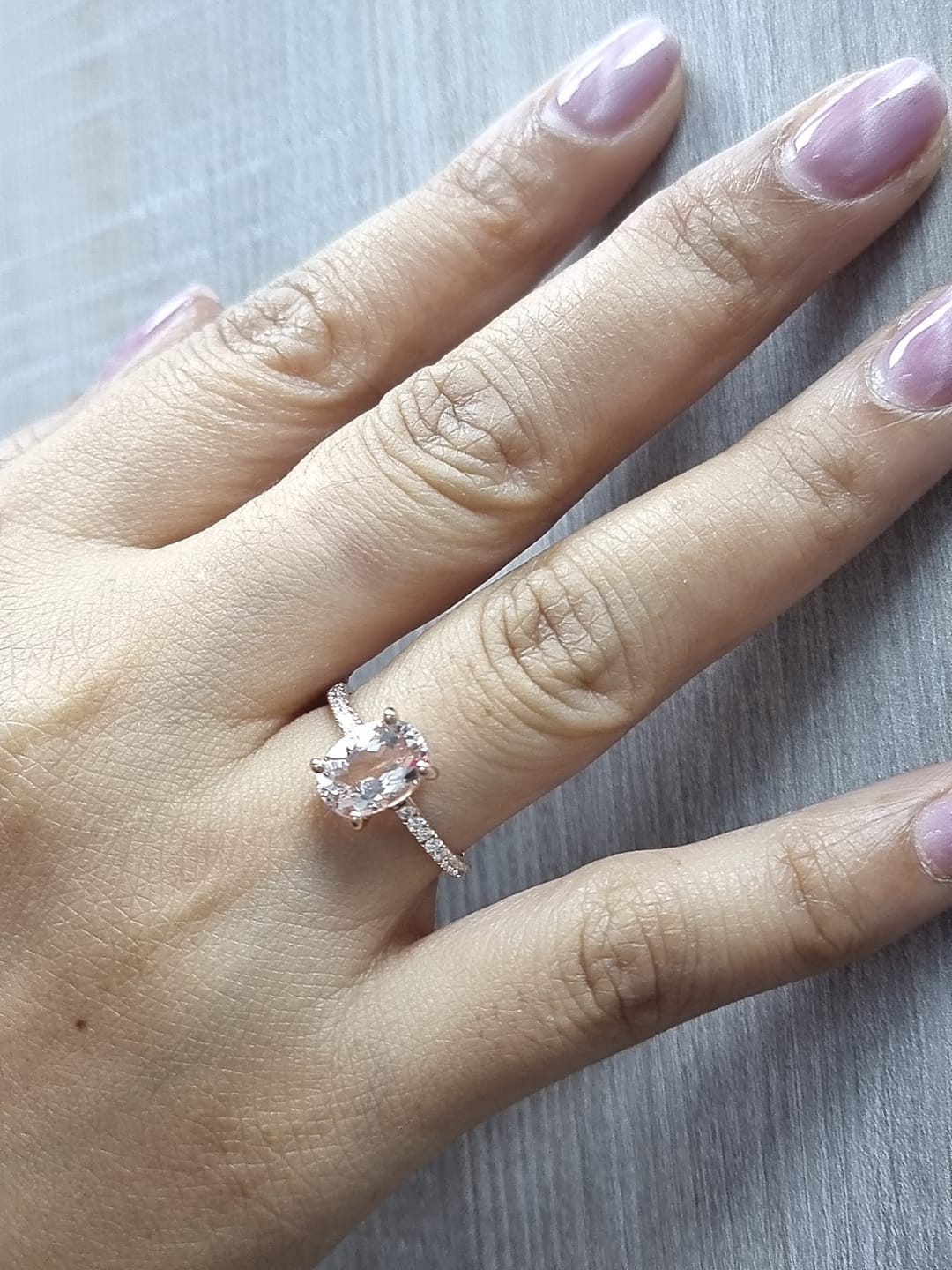 18K rose gold ring with 2.13 carat oval morganite and 0.21 carat diamond accents, elegant contemporary design