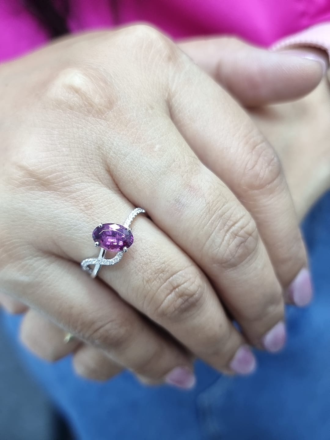 18K white gold Rhodolite garnet and diamond crossover ring with oval-cut center stone