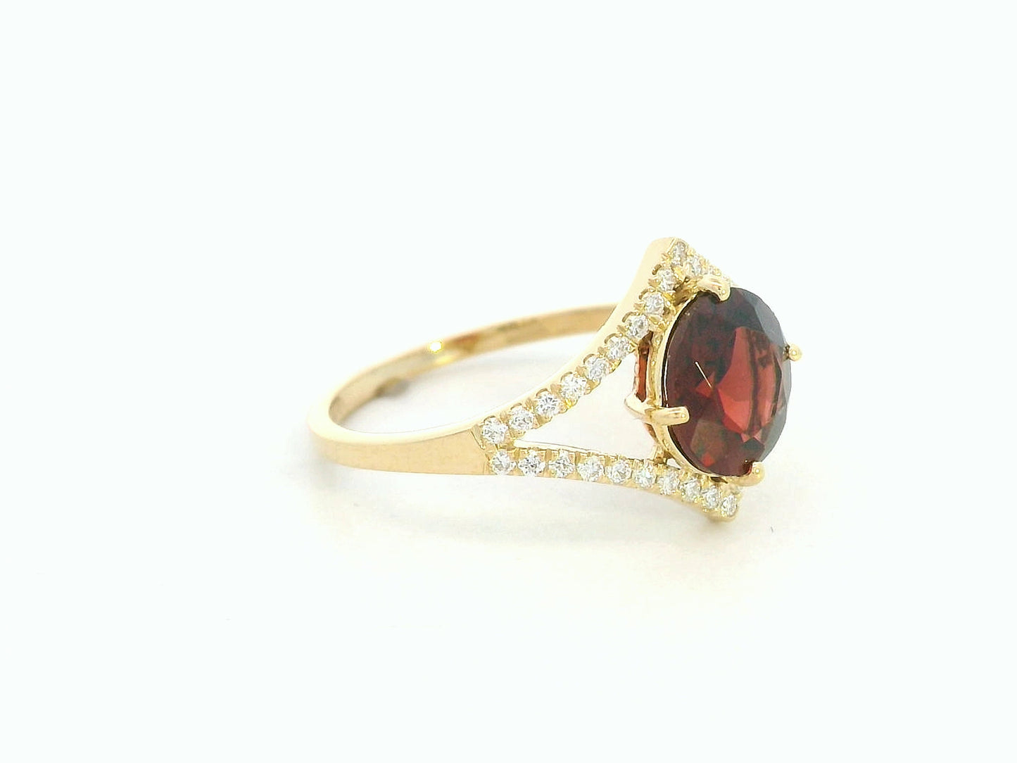 Round garnet split-shank ring with diamond accents in 18K yellow gold