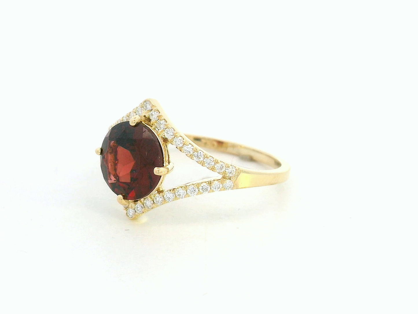 Round garnet split-shank ring with diamond accents in 18K yellow gold