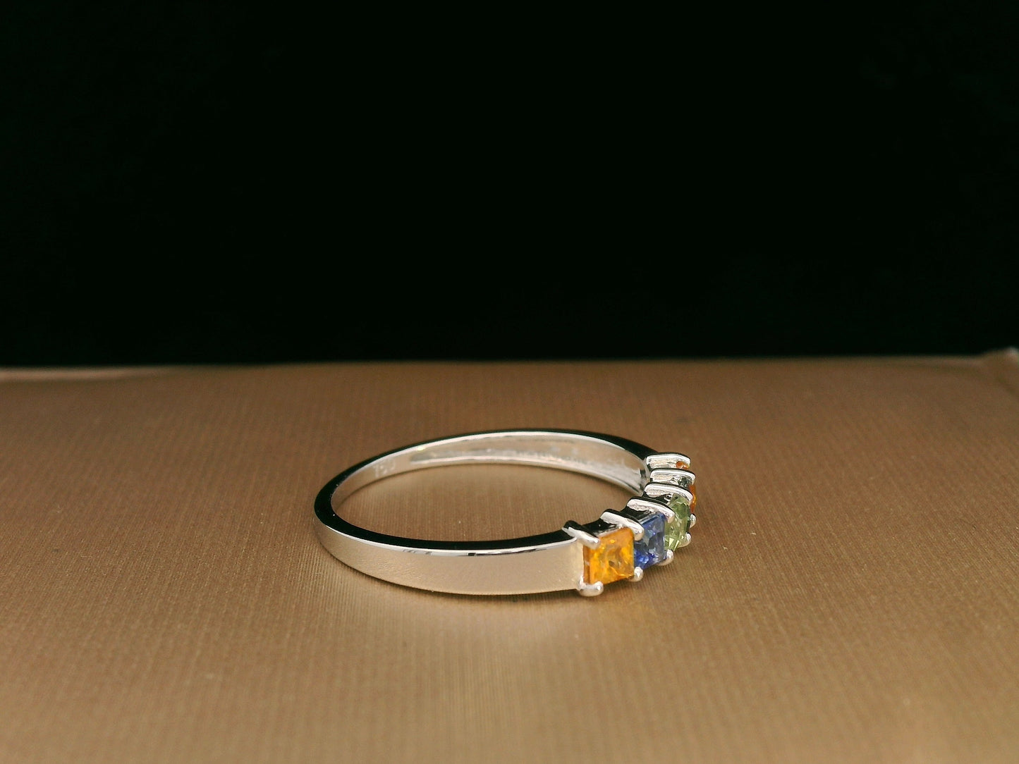Multi-colored princess-cut sapphire ring in 18K white gold