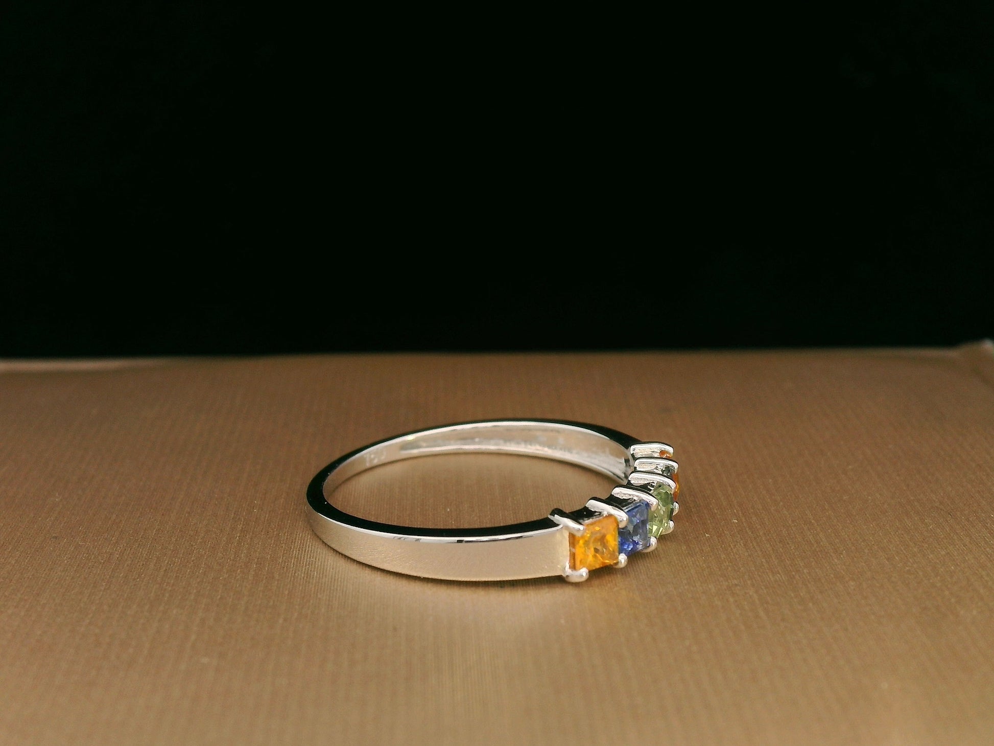 Multi-colored princess-cut sapphire ring in 18K white gold