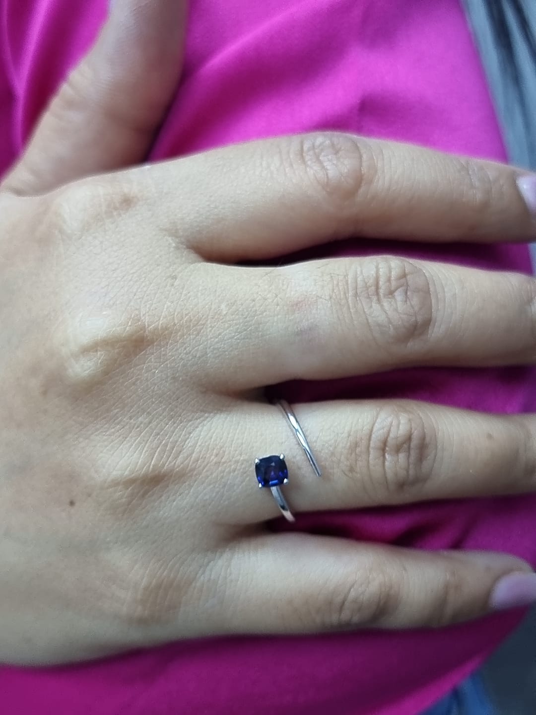 18K gold bypass ring with 0.49 carat cushion-cut blue sapphire, sleek modern design