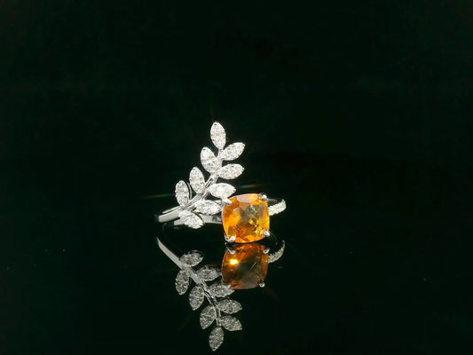 Cushion-cut citrine ring with marquise diamond leaf motif in 18K white gold