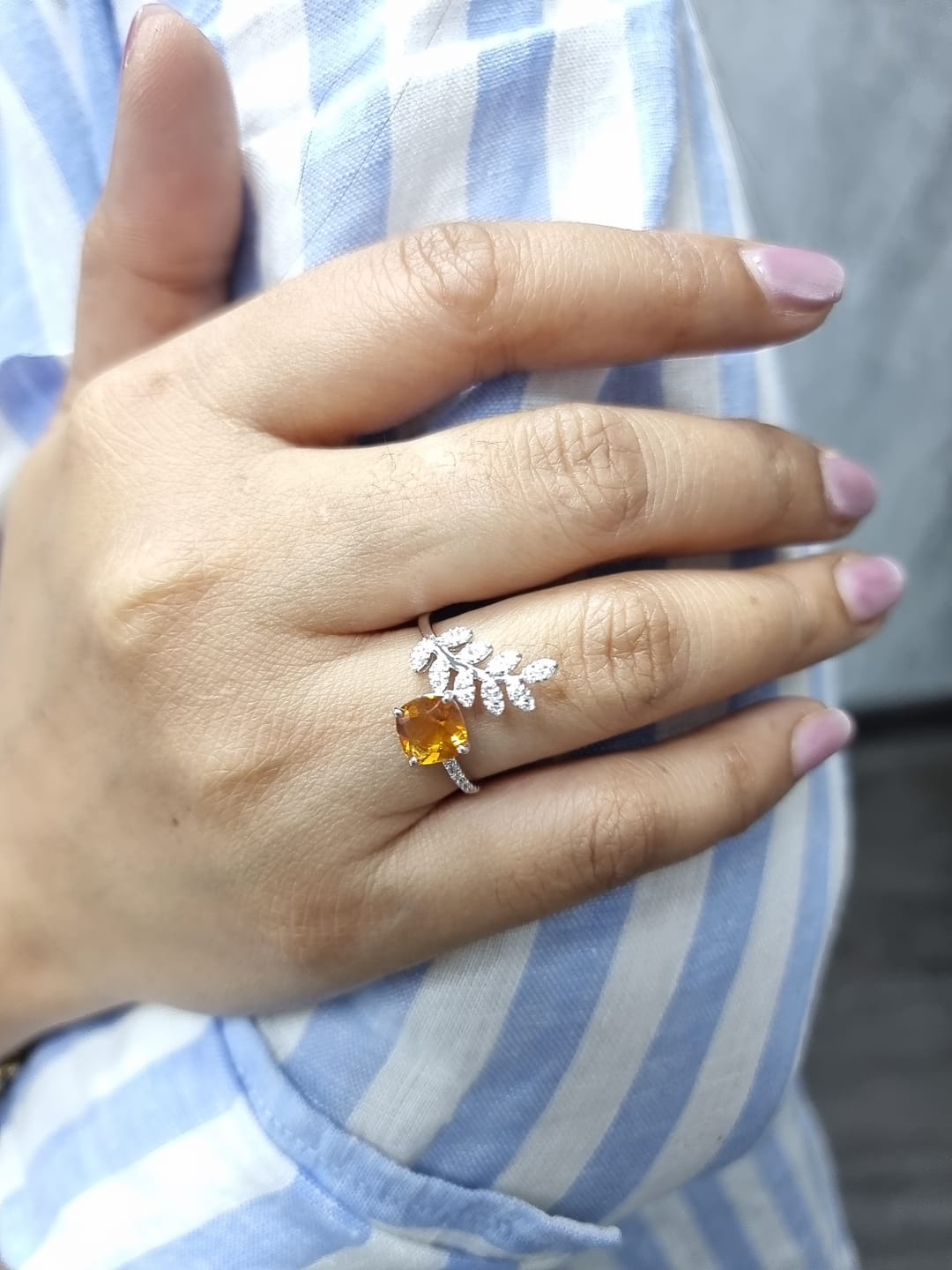Cushion-cut citrine ring with marquise diamond leaf motif in 18K white gold