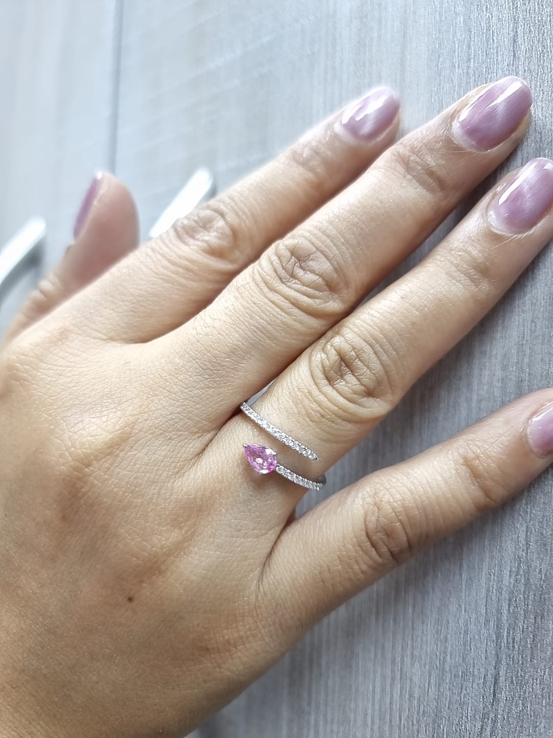 18K white gold open bypass ring with 0.39ct pear pink sapphire and 0.16ct pavé diamonds