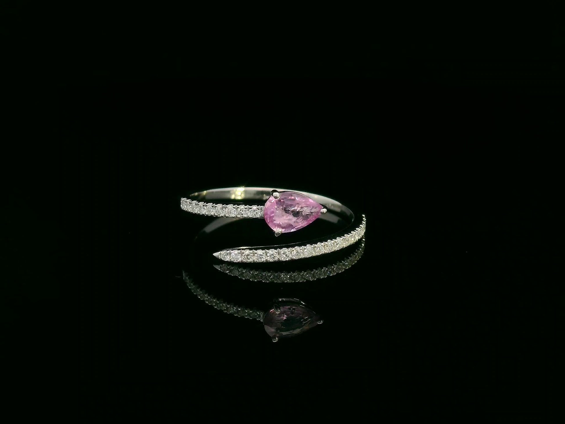 18K white gold open bypass ring with 0.39ct pear pink sapphire and 0.16ct pavé diamonds