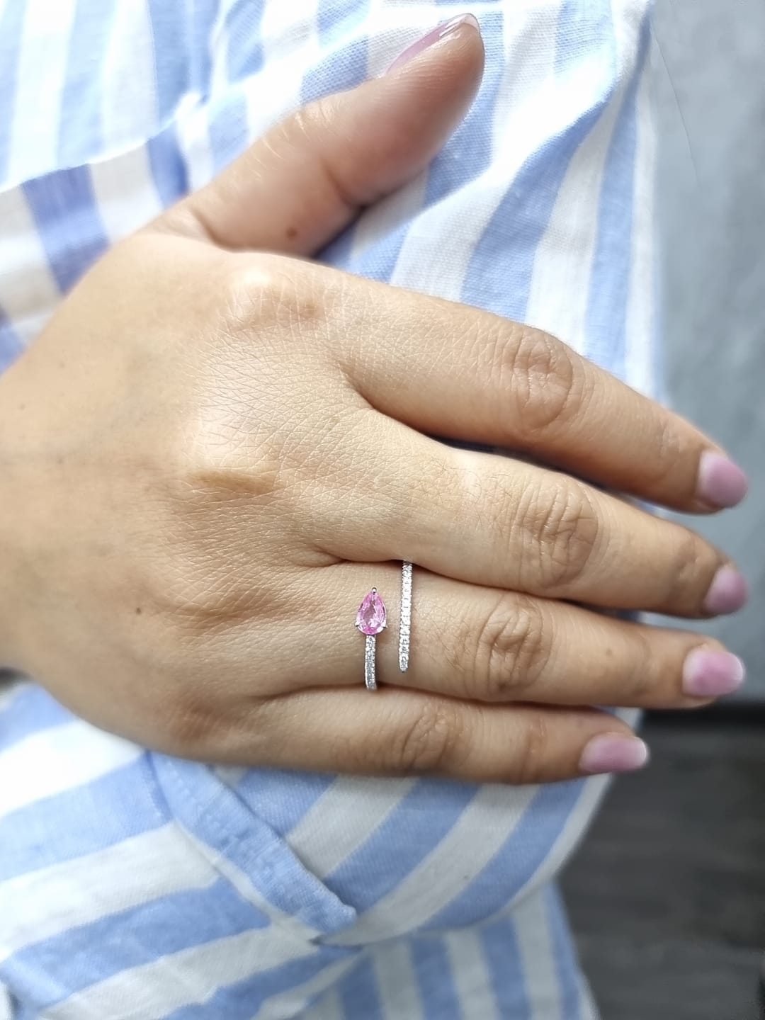 18K white gold open bypass ring with 0.39ct pear pink sapphire and 0.16ct pavé diamonds