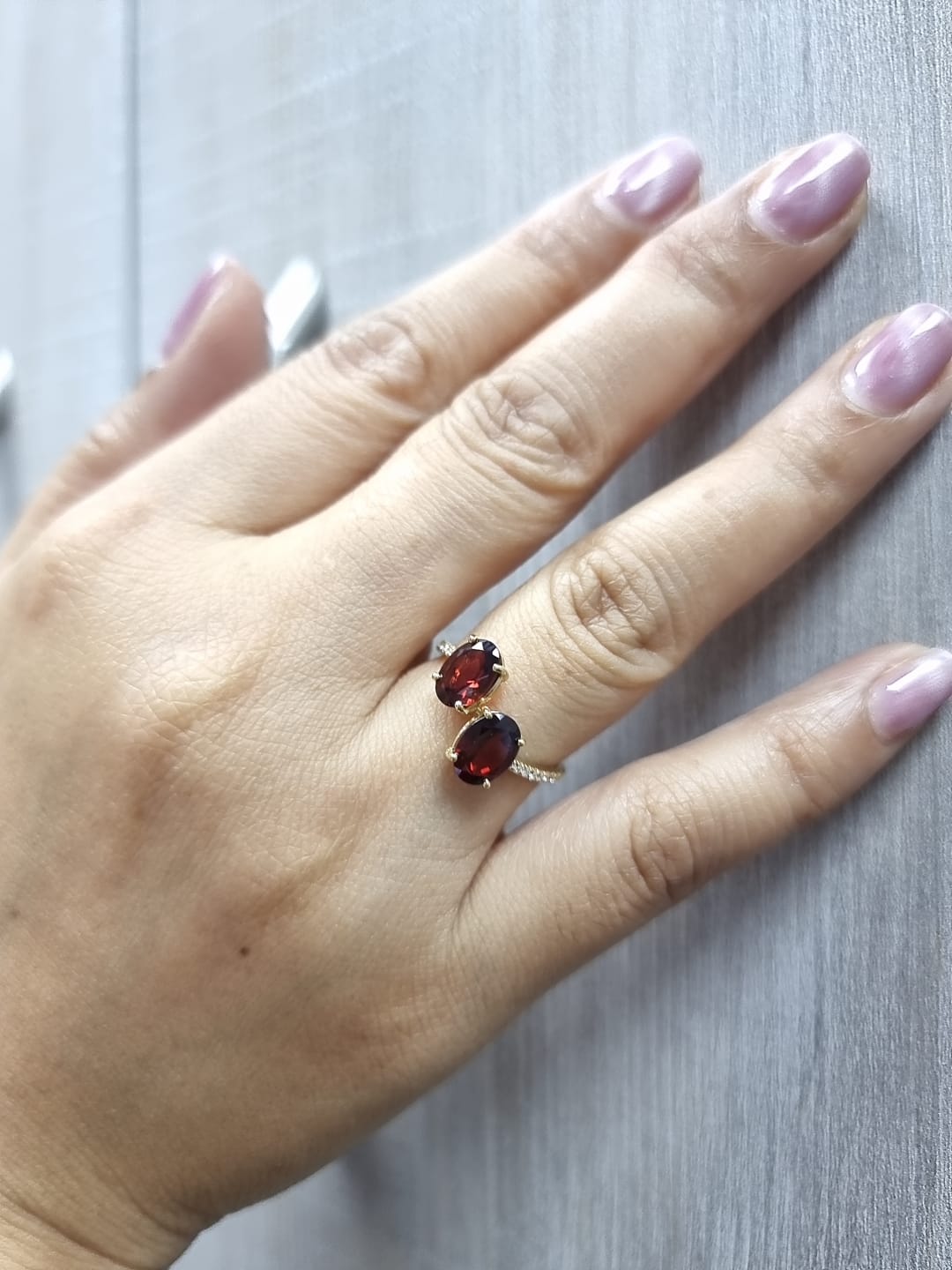 18K yellow gold men’s garnet toi et moi bypass ring with 2.62ct oval garnets and 0.12ct pavé diamonds