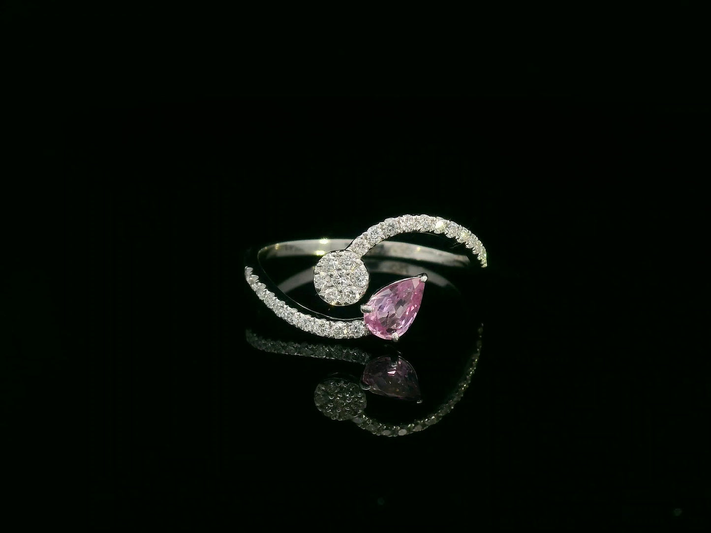 18K white gold bypass ring with pear-cut pink sapphire and diamond cluster