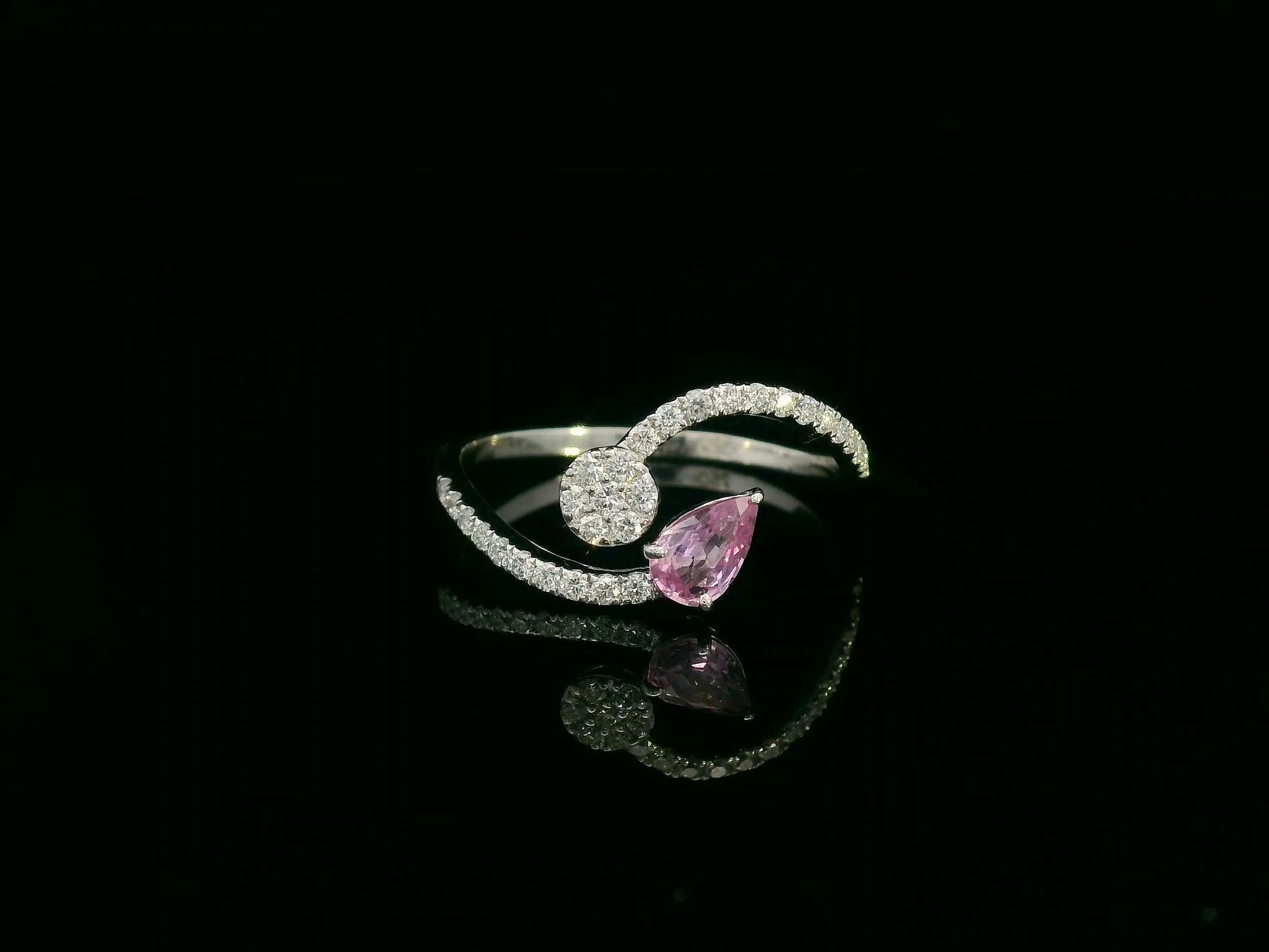 18K white gold bypass ring with pear-cut pink sapphire and diamond cluster