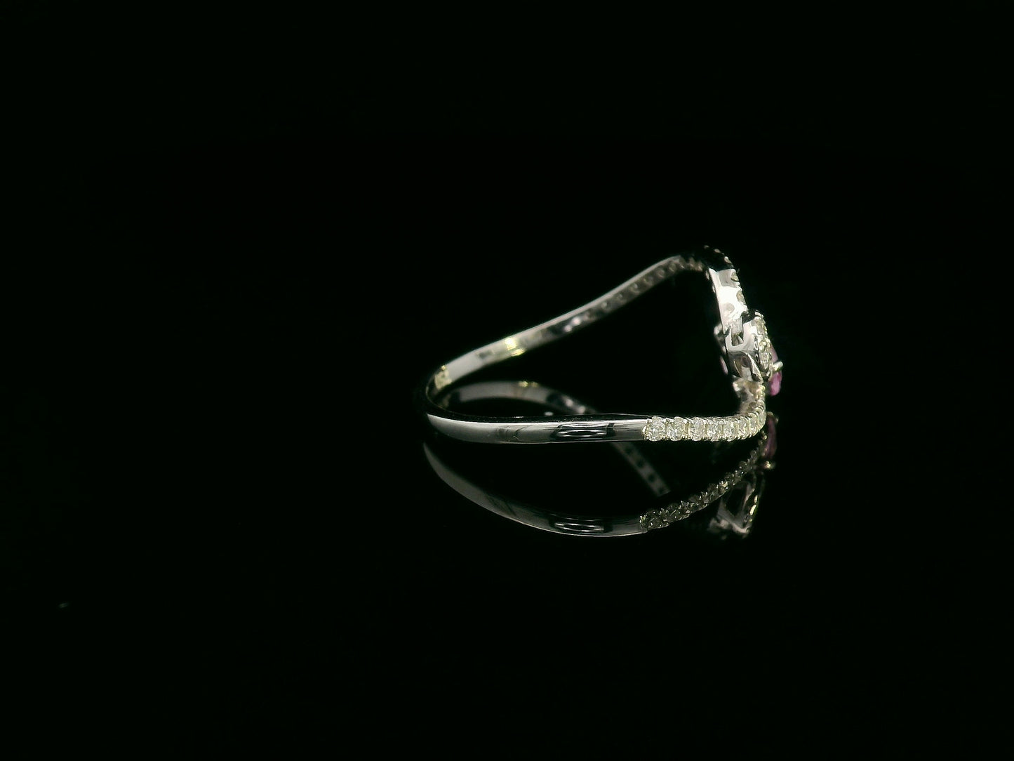 18K white gold bypass ring with pear-cut pink sapphire and diamond cluster