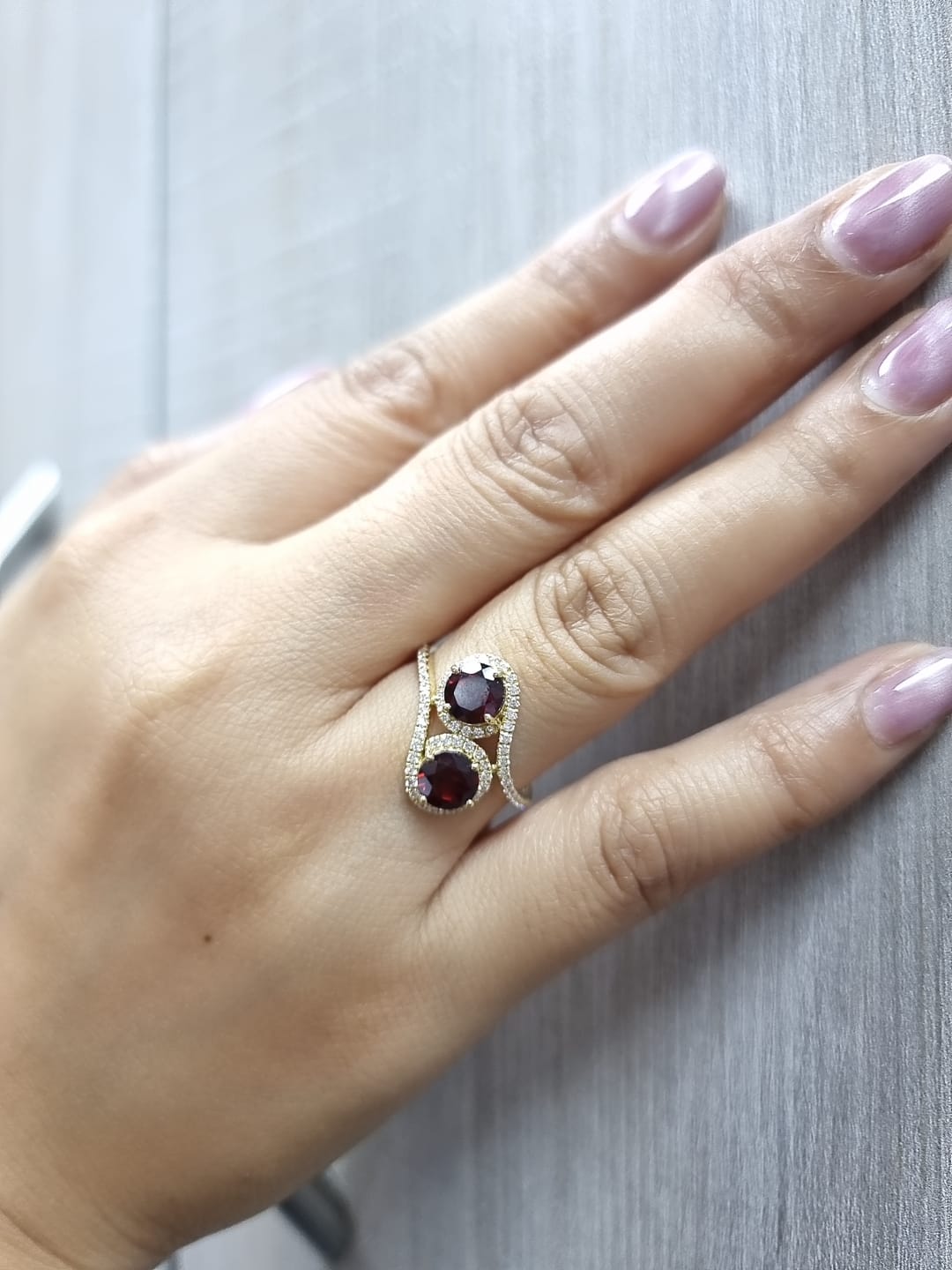 18K yellow gold double halo bypass ring with 2.79 carat red garnets and 0.33 carat diamonds, toi et moi statement design