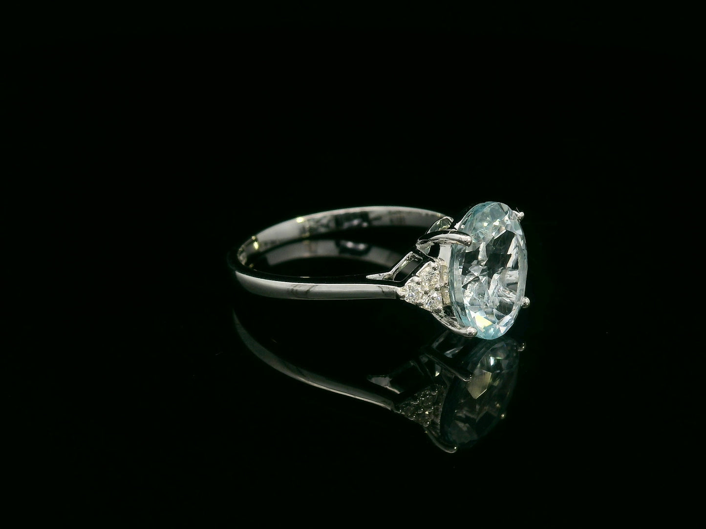 18K white gold oval aquamarine ring with diamond side clusters – 2.45ct aquamarine, 0.08ct diamonds by Emirates Diamonds