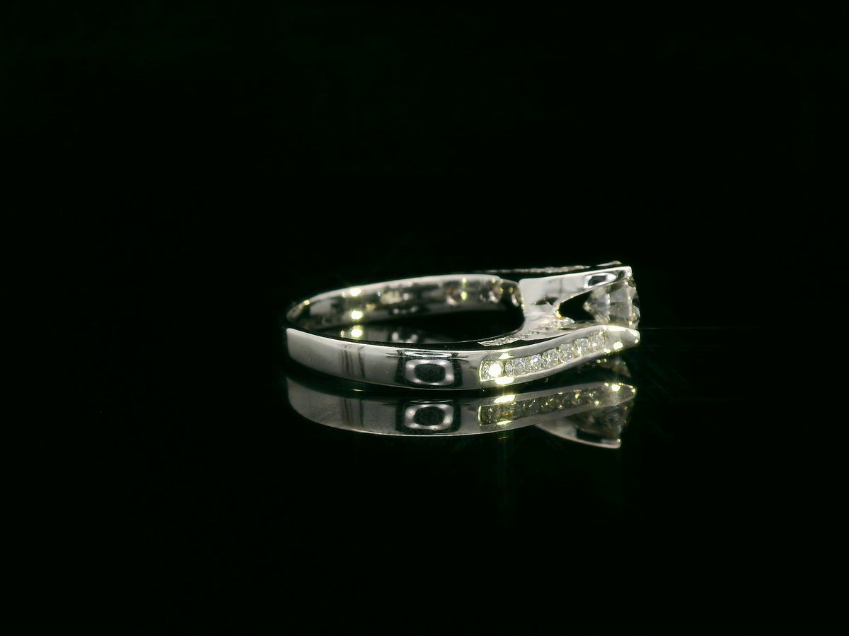 18K white gold engagement ring with 1.01ct round diamond center and diamond split-shank design – Emirates Diamonds