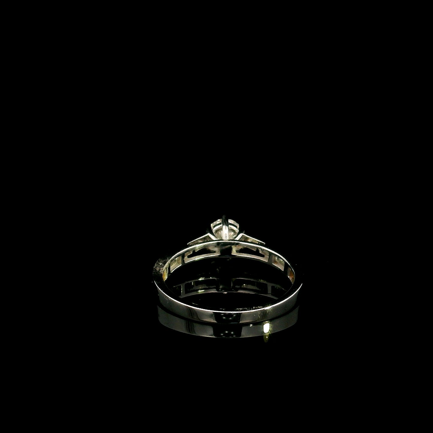 18K white gold engagement ring featuring a 0.60 carat GIA certified natural round brilliant diamond with F color and SI2 clarity, accented by 0.25 carat natural round diamonds on the shoulders in a classic six-prong setting.